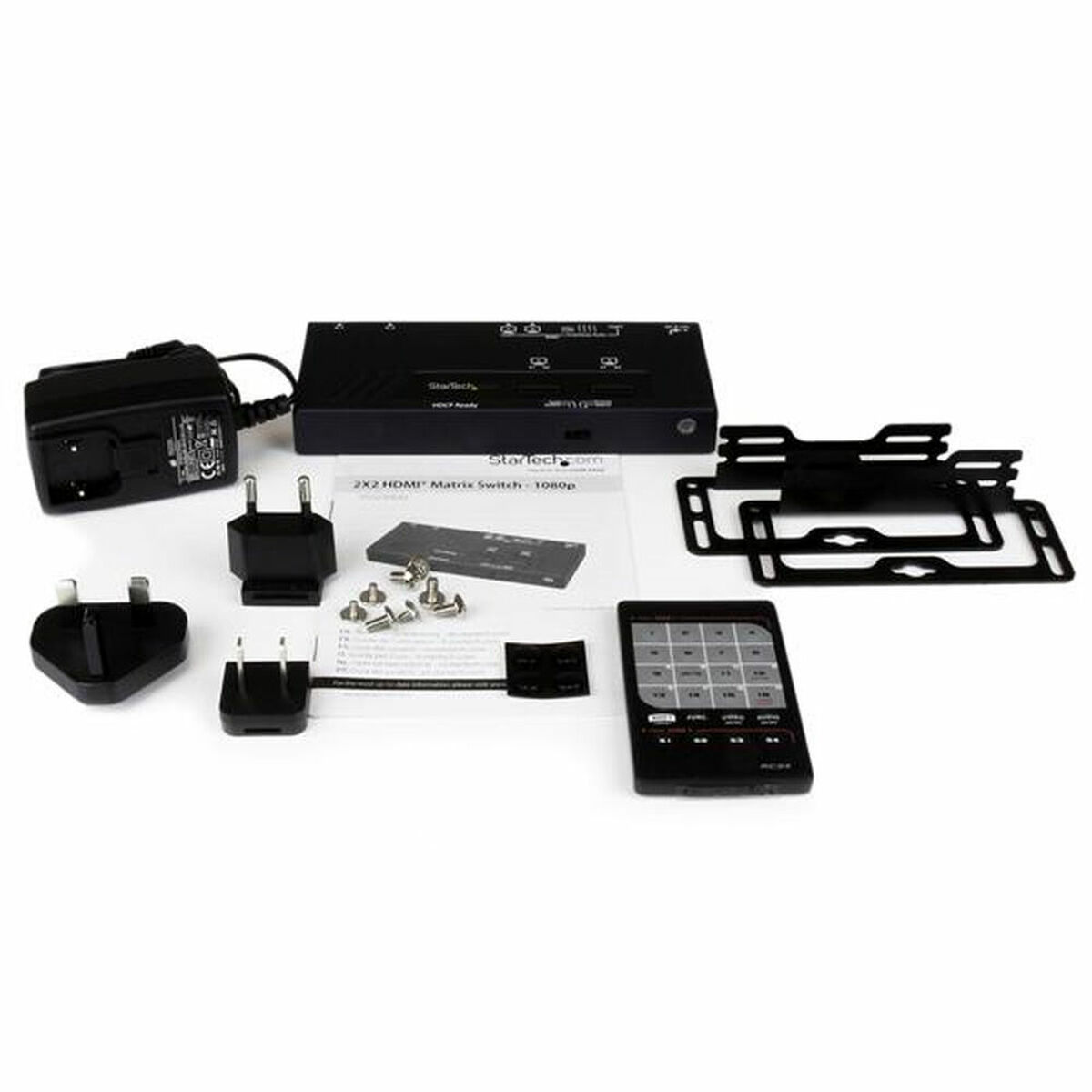 Juego de conmutador matricial HDMI 2x2 StarTech. Incluye conmutador, mando, cables y fuente.