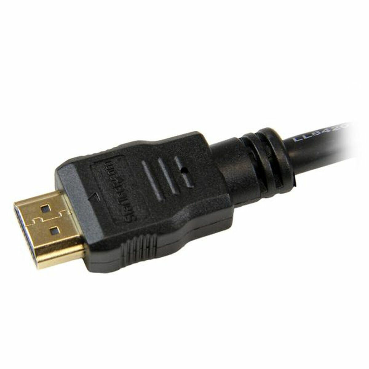 Primer plano de un conector HDMI. El conector es negro y dorado.