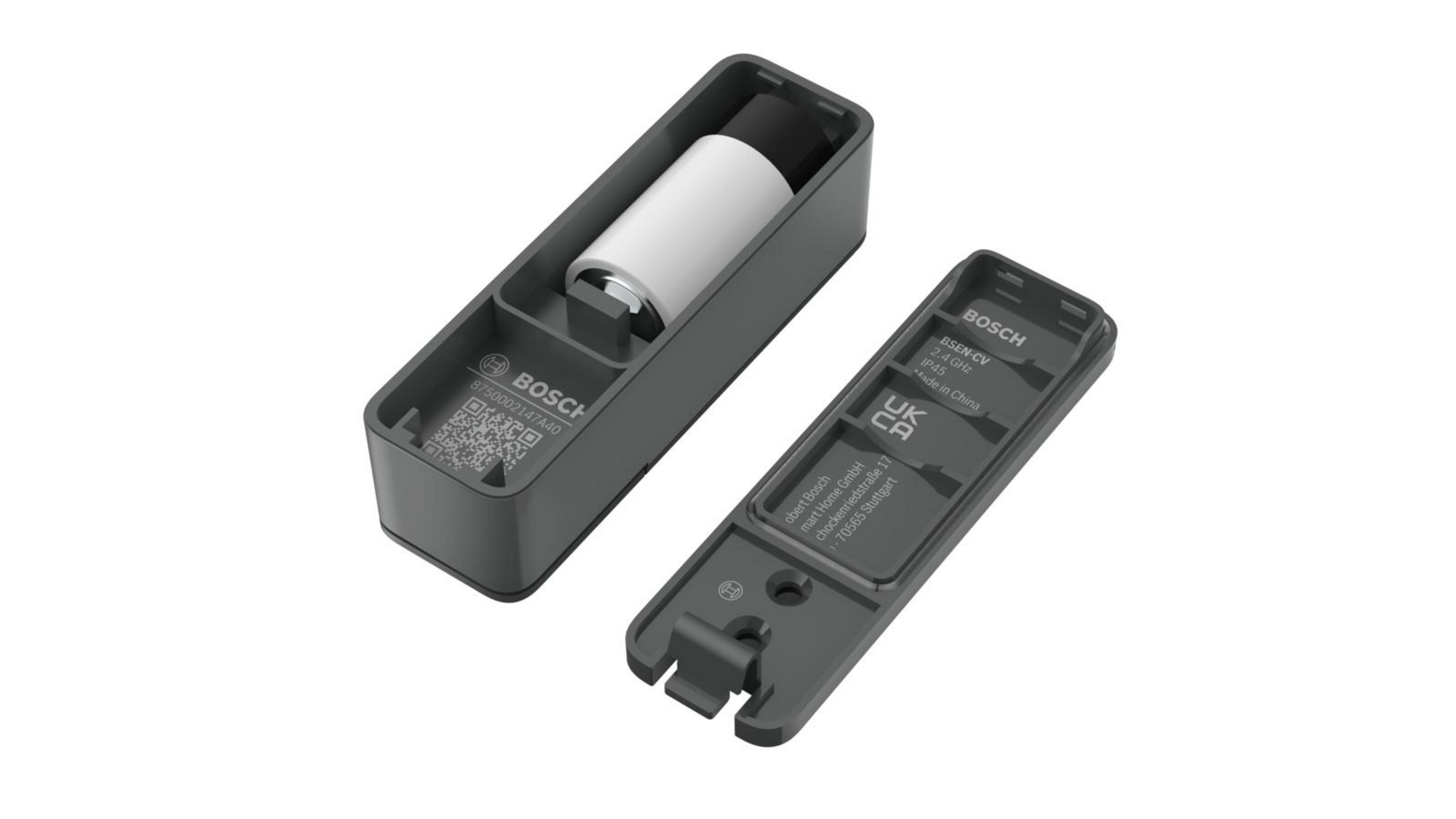 Otwarty szary urządzenie Bosch z białym cylindrem w środku i odłączoną pokrywą.