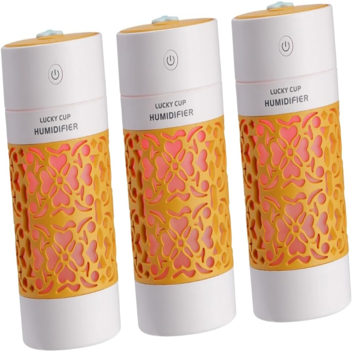 Drei zylindrische Luftbefeuchter, weiß und orange, mit floralem Design und einem Ein-Aus-Knopf.