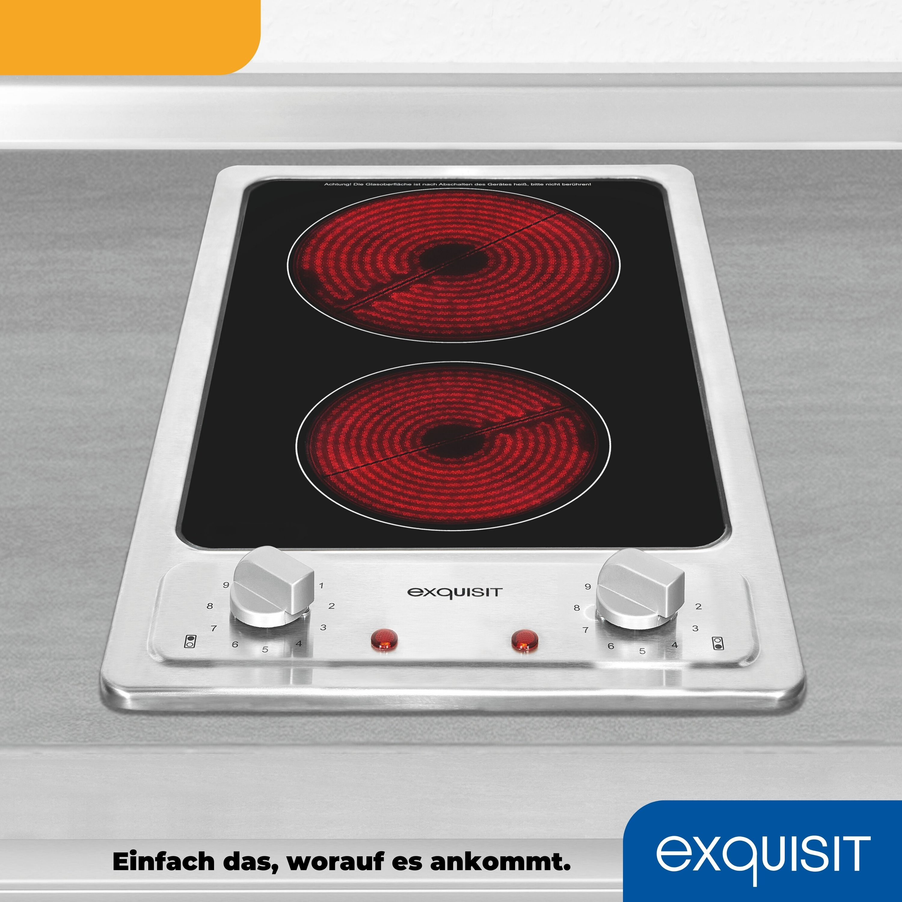 Płyta indukcyjna z dwoma czerwonymi okrągłymi elementami grzejnymi i pokrętłami sterowania.