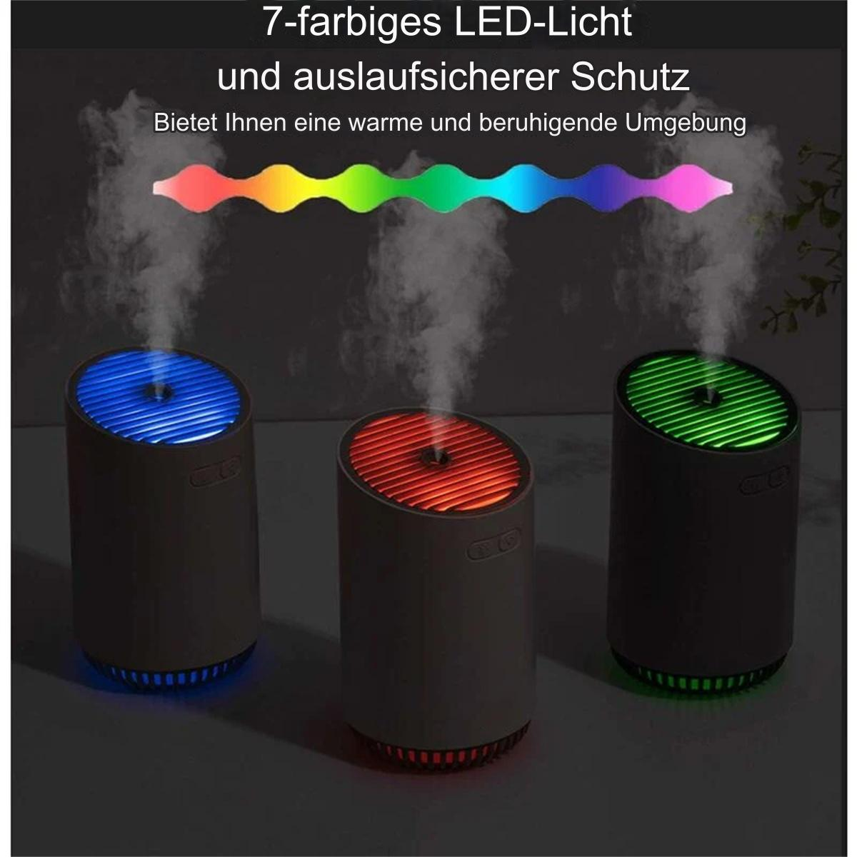 Drei Luftbefeuchter, die farbigen Dampf ausstoßen, mit einem Regenbogen aus LED-Lichtern.