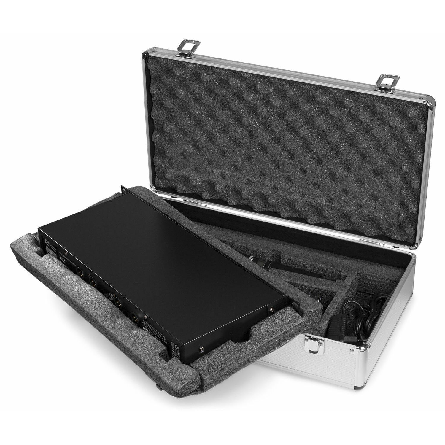 Open silver case with black foam. Inside, a black device rests in foam. Cables and accessories are visible.