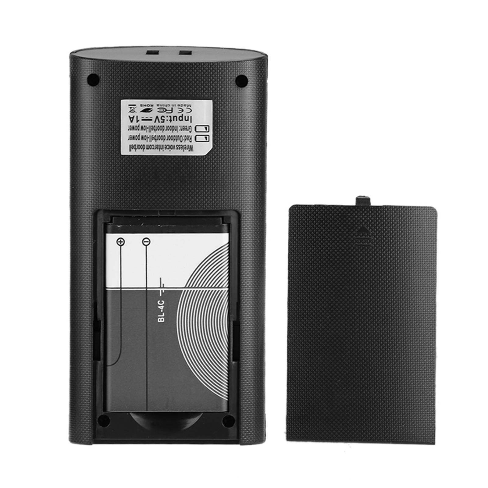 Die Rückseite einer schwarzen Türklingel mit offenem Batteriefach. Die Batterie ist eingesetzt. Die Abdeckung ist ab.