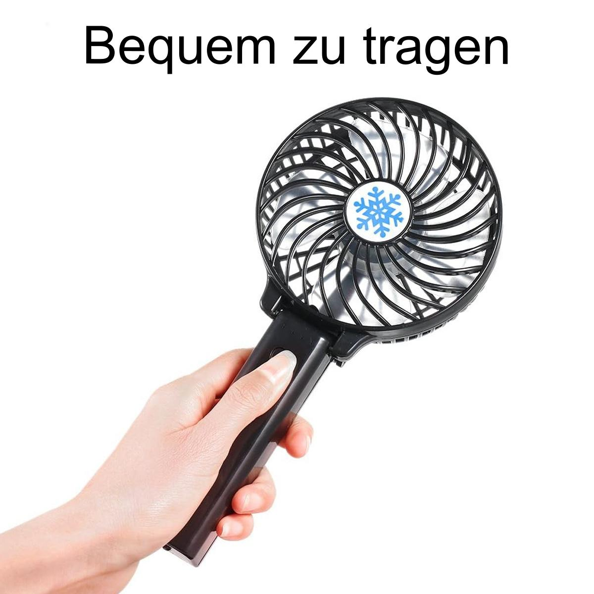 Hand hält einen kleinen rosa Handventilator. Ventilator hat einen schwarzen Griff.