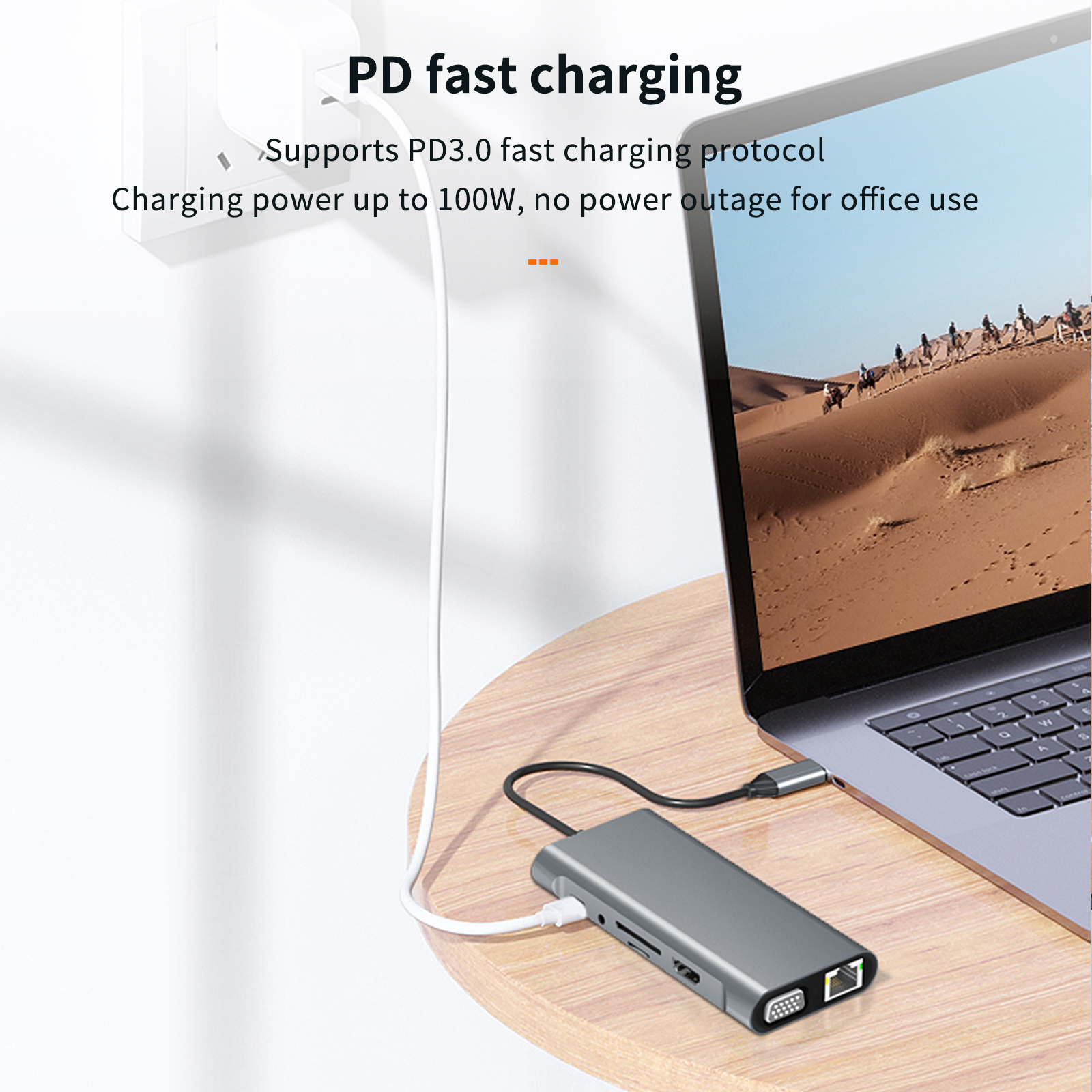 Ein Laptop, der mit einem Hub verbunden ist. Unterstützt PD-Schnellladung bis 100 W.