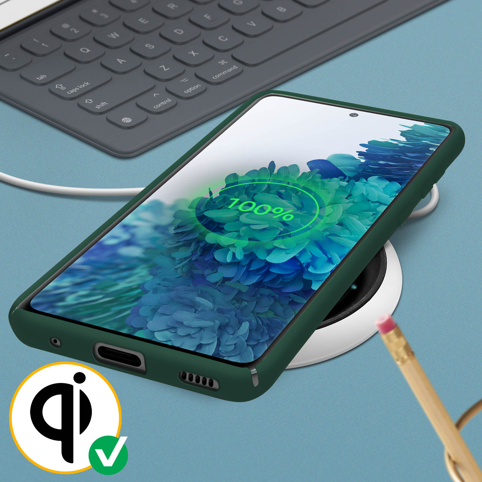 Téléphone vert dans un étui vert, chargeant sur un chargeur sans fil blanc. Table bleue.