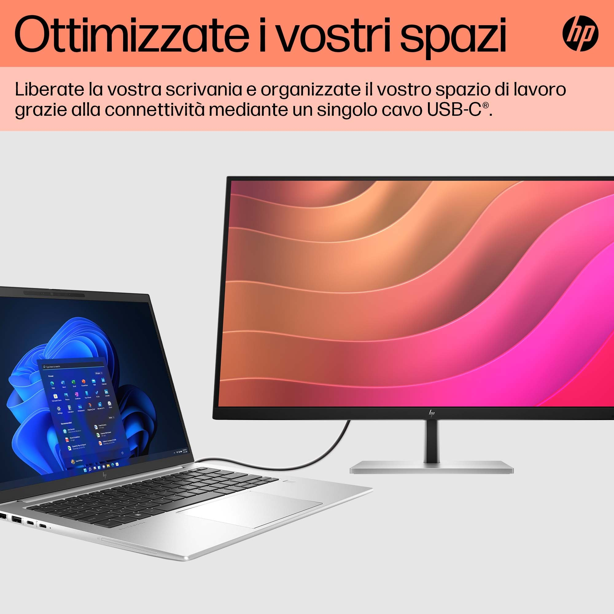 Laptop podłączony do monitora HP. Monitor wyświetla kolorową grafikę.