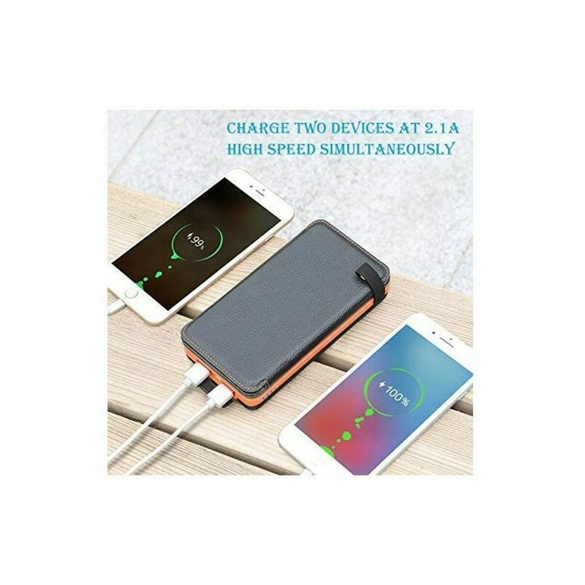 Zwei Telefone laden mit einer Powerbank. Telefone zeigen Ladestatus, Bank grau-orange.