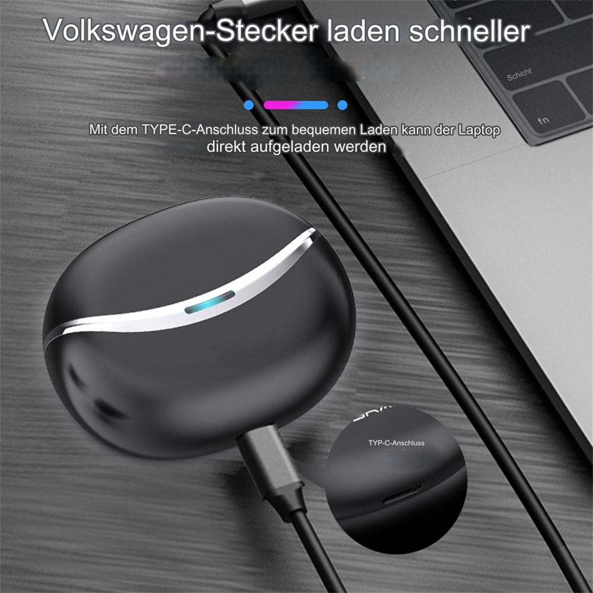 Schwarzes Gerät, das mit einem Laptop daneben lädt.