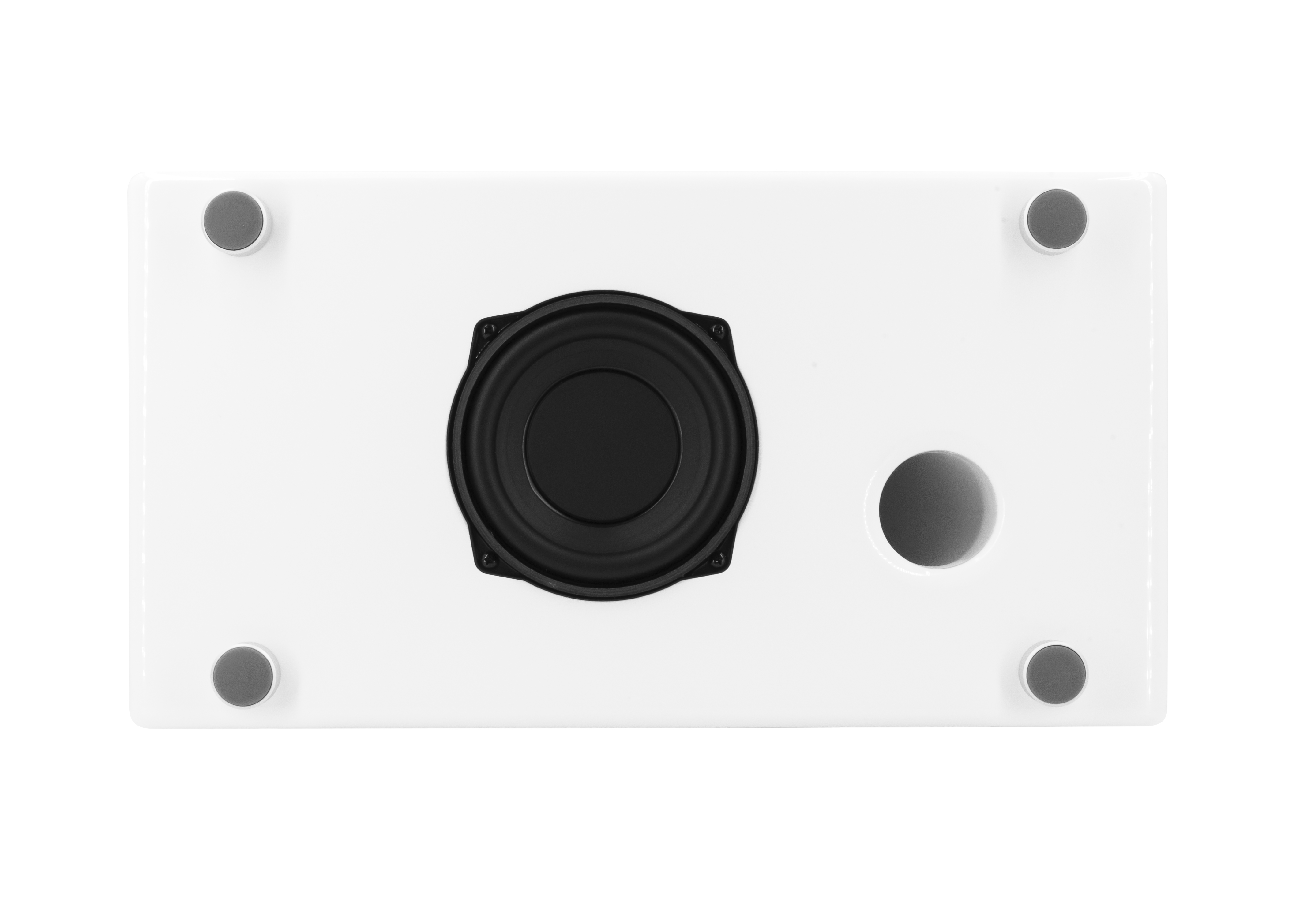 Bottom view of a white speaker. It has a black speaker, a hole, and four gray rubber feet.