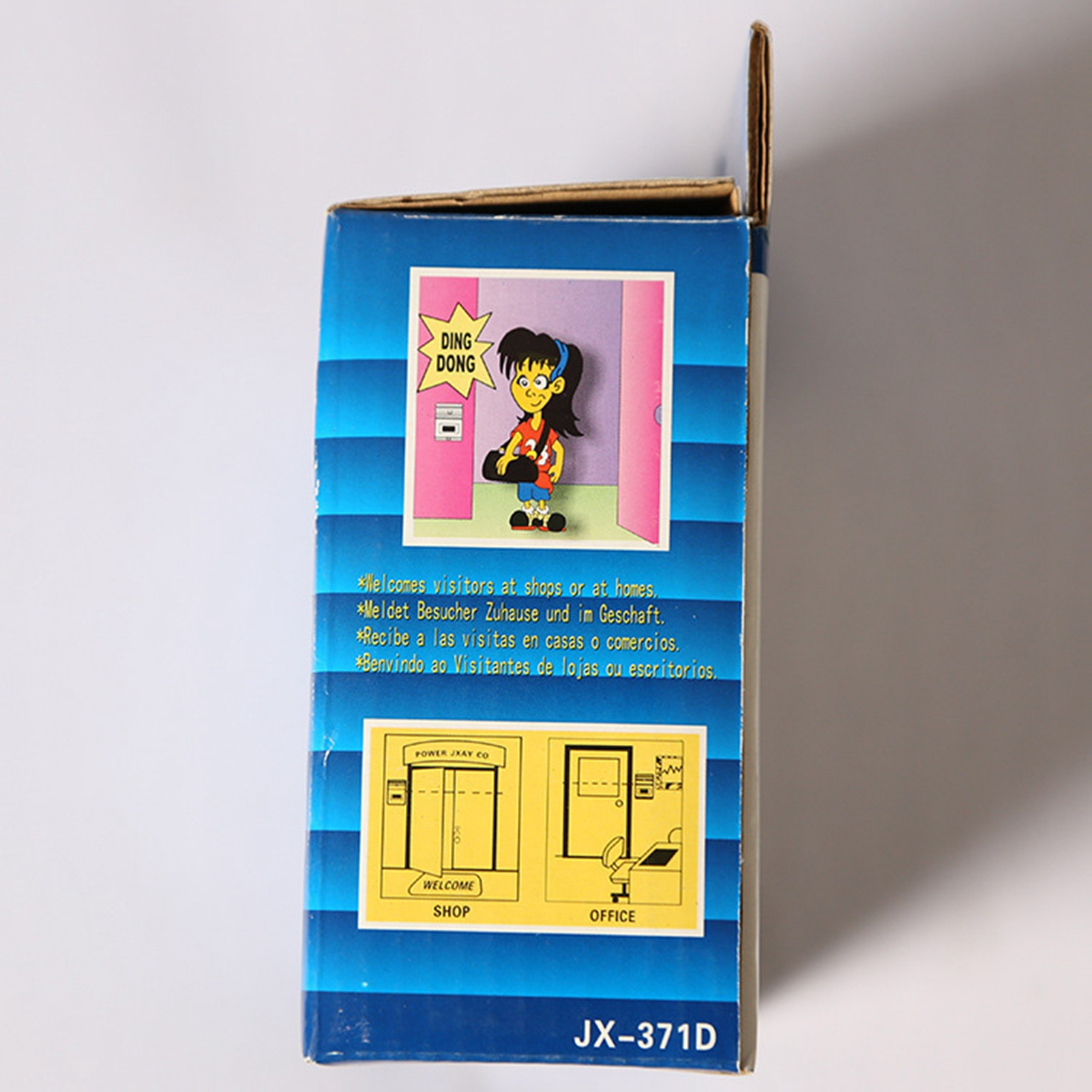 Schachtel mit Zeichnung eines Mädchens, das 'Ding Dong' sagt, und Diagramm Shop/Büro.