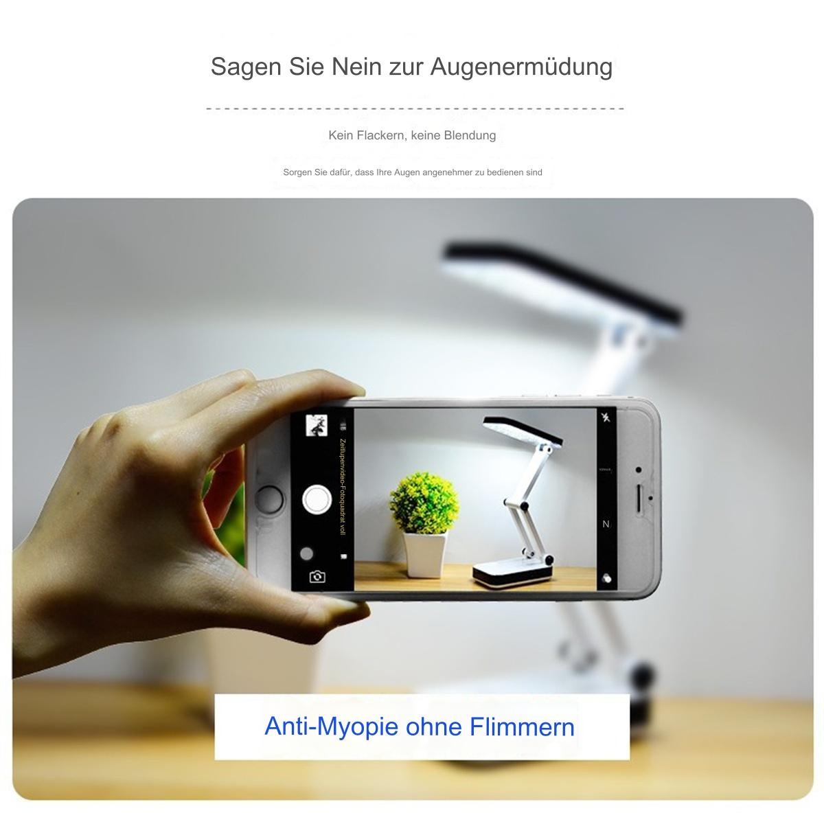 Eine Person hält ein Telefon, das ein Foto einer Schreibtischlampe mit einer Pflanze aufnimmt, Text sagt: Anti-Myopie.