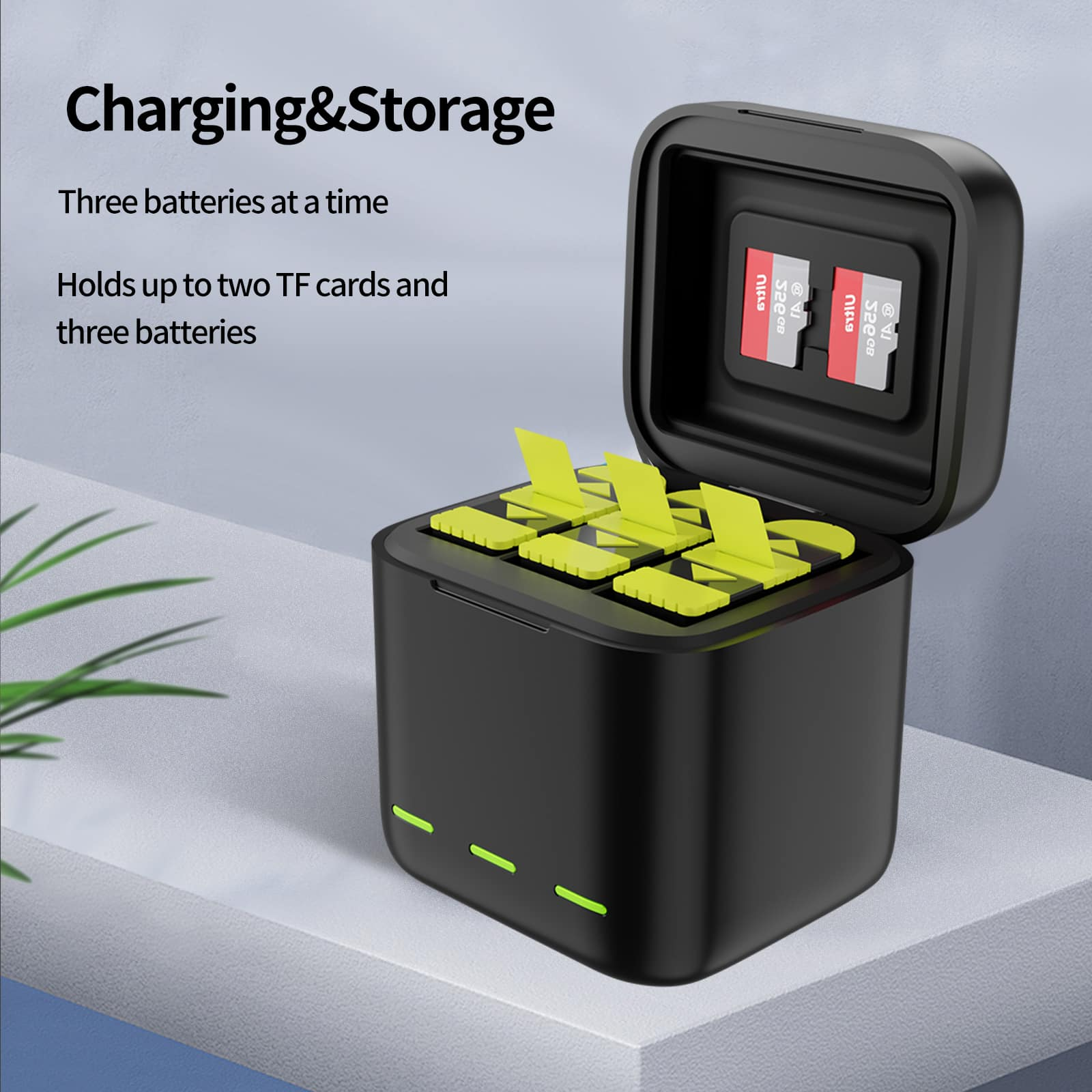 Une boîte noire de chargement et de stockage avec des cartes SD et des supports de batterie jaune-vert à l'intérieur.