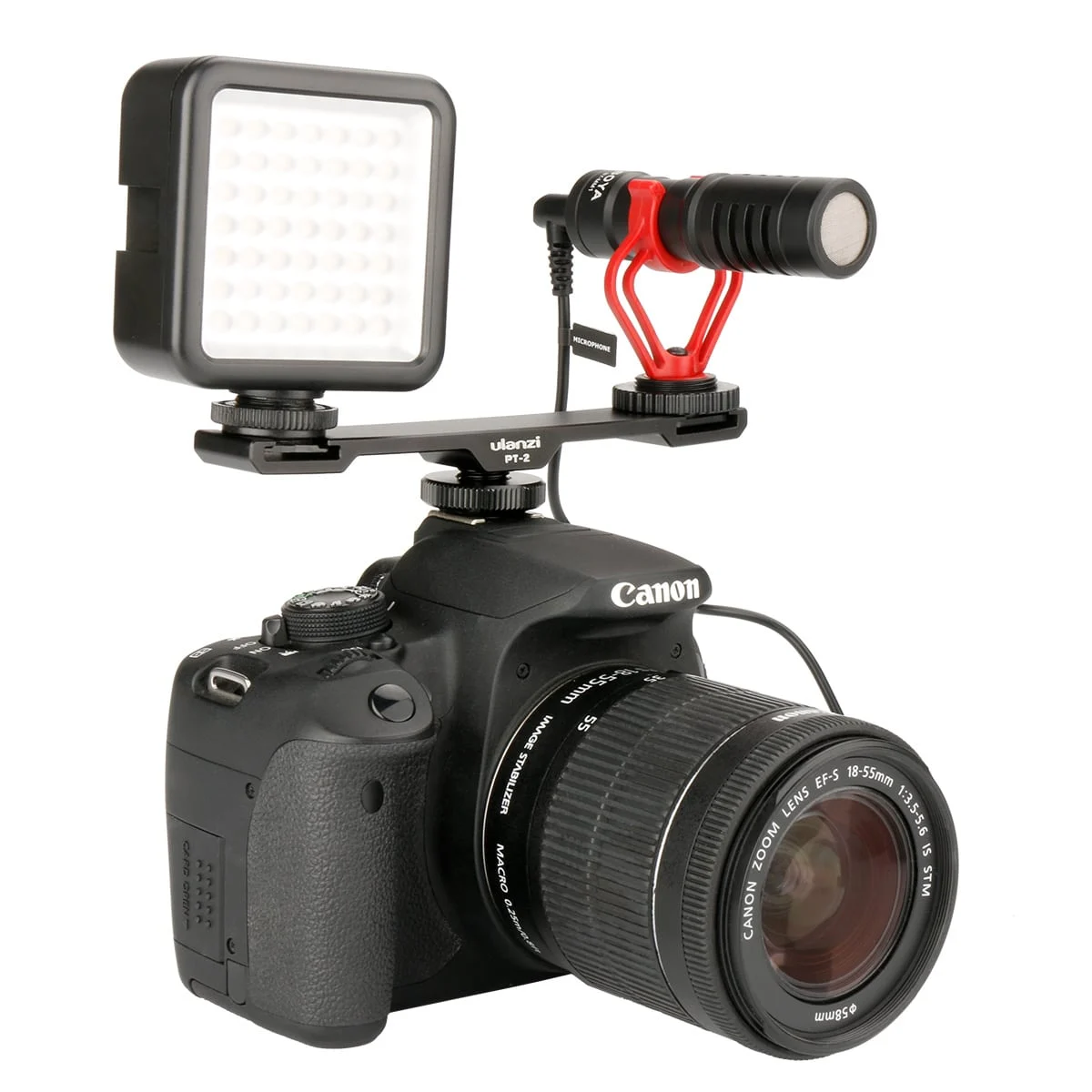 Fotocamera con luce e microfono collegati, rivolta verso sinistra.