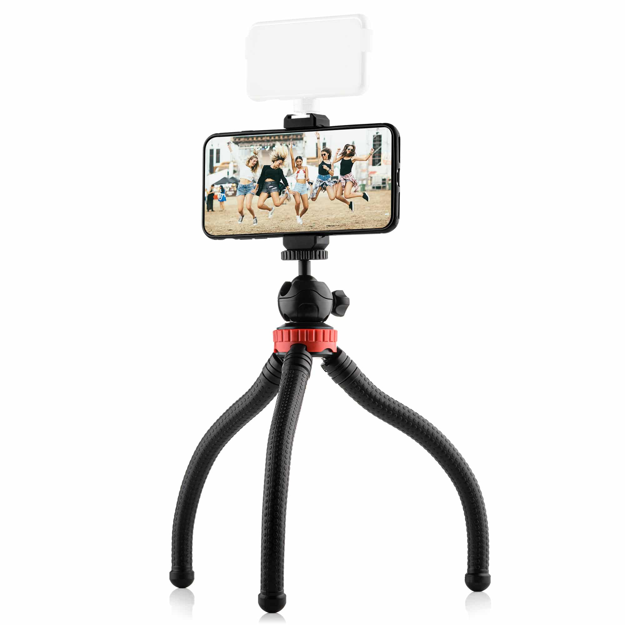 Un smartphone sur un trépied flexible. Le téléphone affiche des personnes sautant devant un bâtiment.