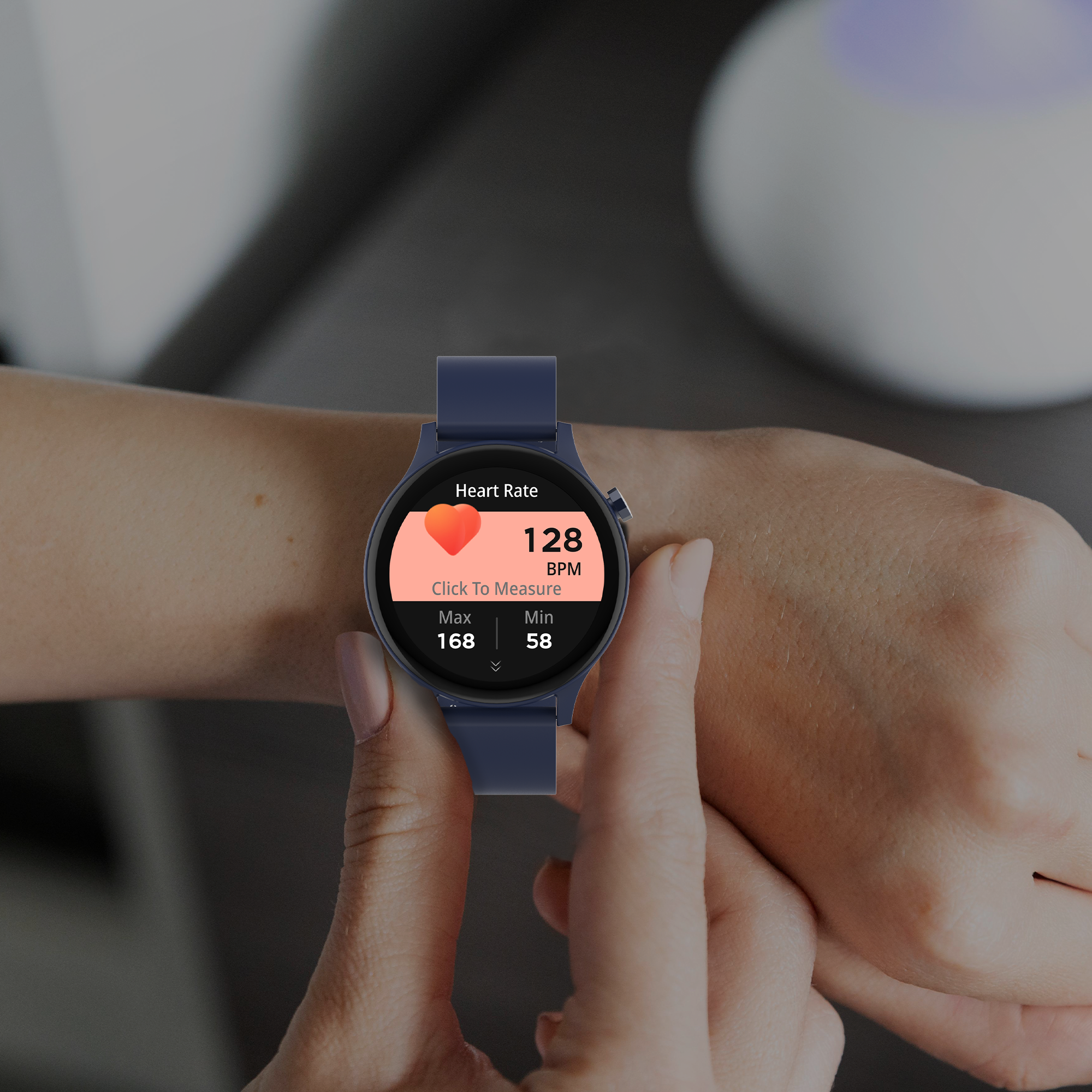A person wearing a navy blue smartwatch. The watch displays heart rate information on a red background.