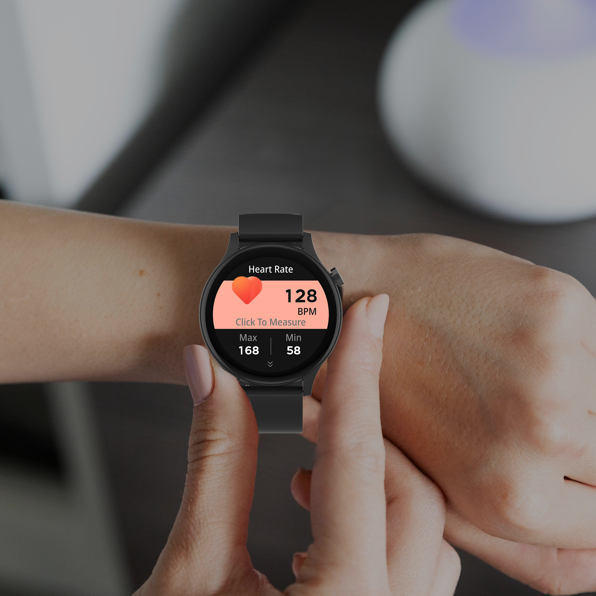 A person's wrist with a black smartwatch displaying heart rate information.