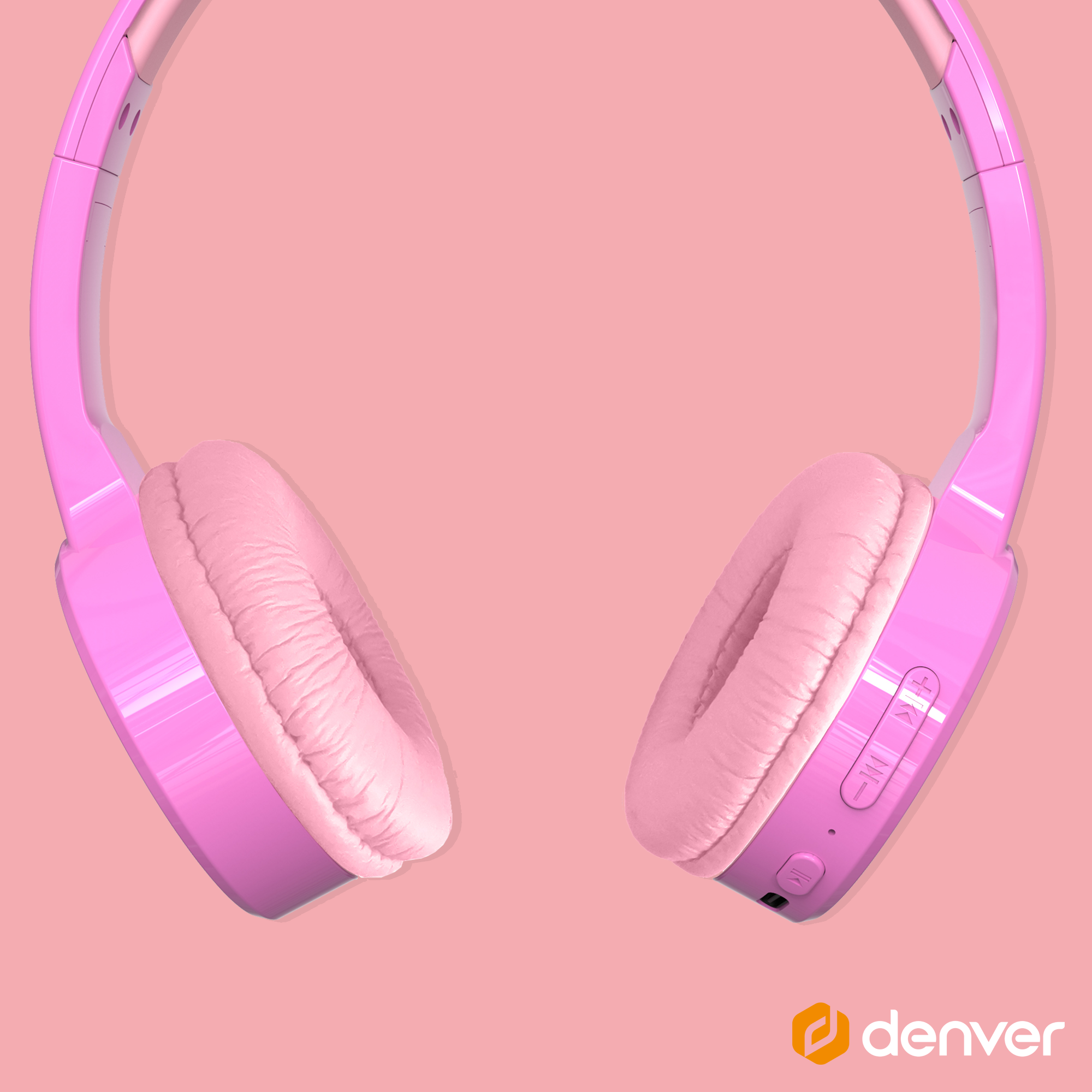 Różowe słuchawki na różowym tle. Słuchawki są w stylu nausznym.
