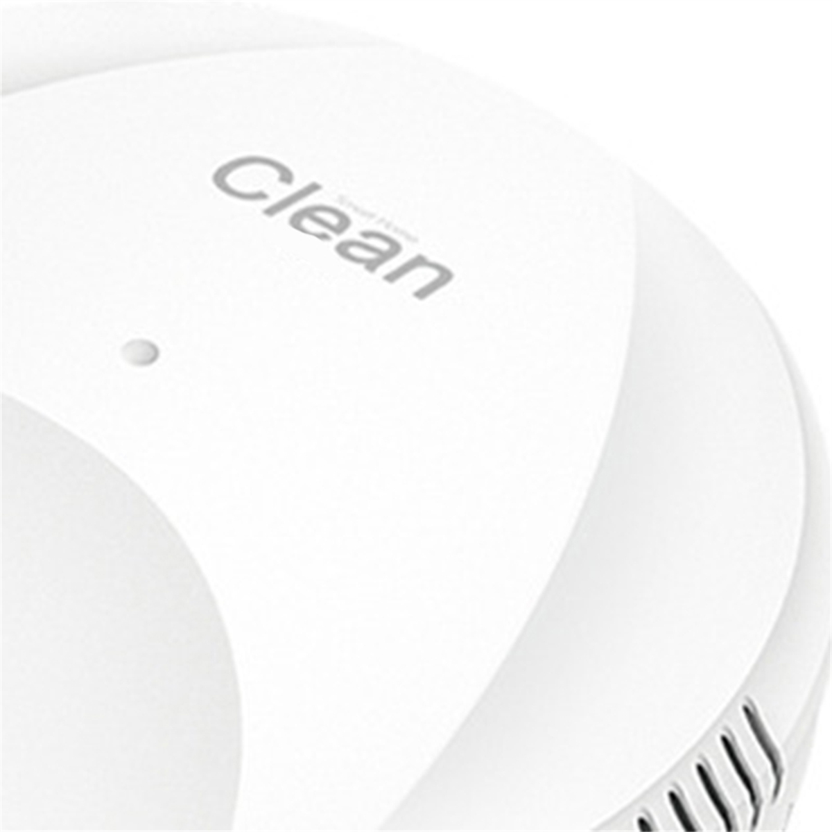 Ein weißes kreisförmiges Gerät mit dem Wort „Clean“. Das Gerät hat Löcher an der Unterseite.