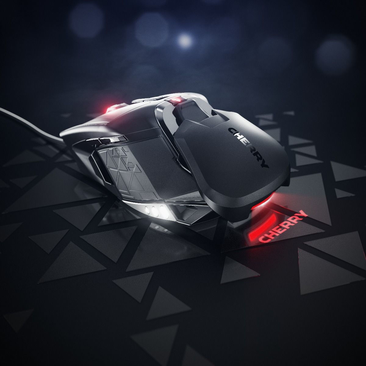 Black gaming mouse with red lights and the word CHERRY written. Black background, close-up.