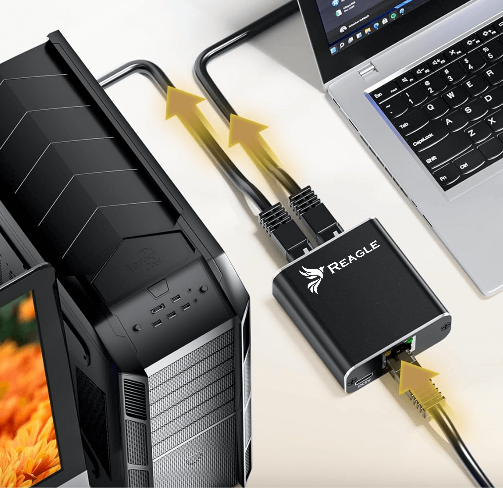 Konfiguracja z komputerem, monitorem i czarnym urządzeniem Reagle. Kable łączą urządzenia.