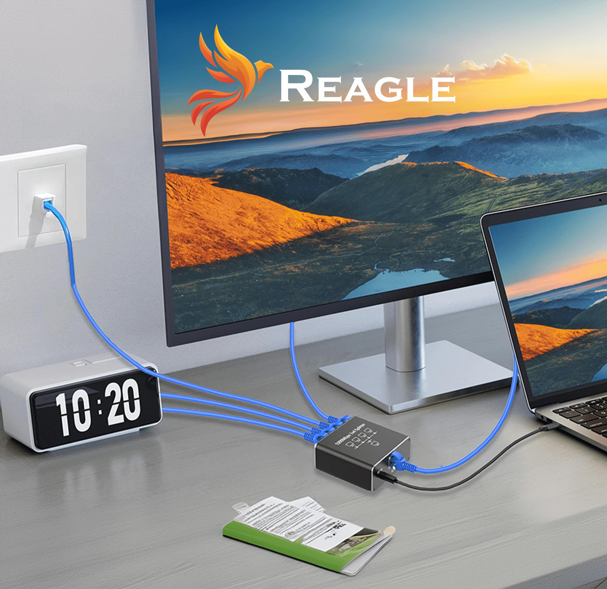 Konfiguracja z monitorem, laptopem i urządzeniem połączonym niebieskimi kablami. Monitor wyświetla obraz krajobrazu.