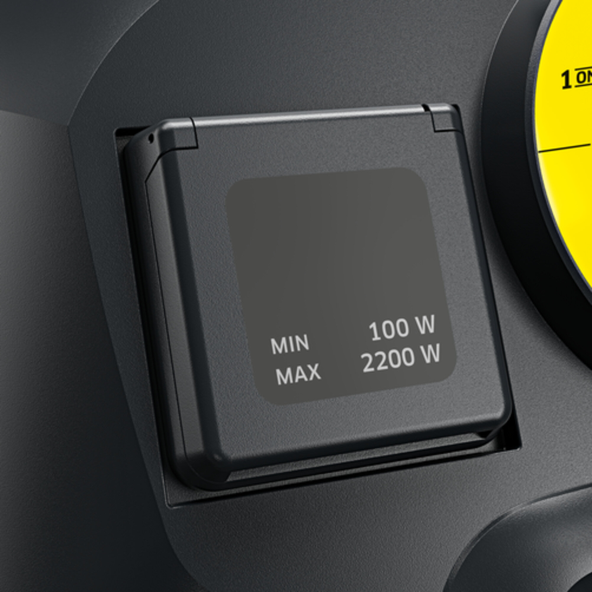 Czarne gniazdo z tekstem: MIN 100W, MAX 2200W. Gniazdo znajduje się na czarnej powierzchni.