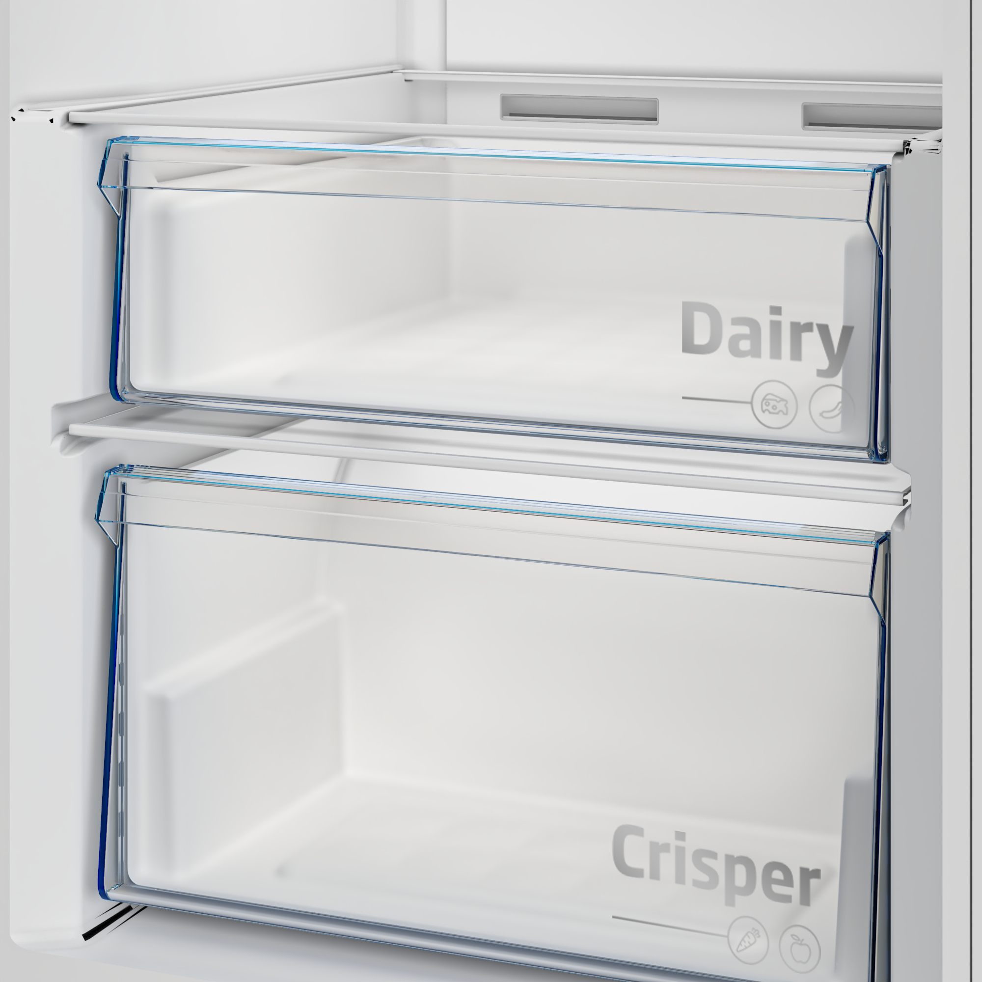 Interior del refrigerador. Dos cajones transparentes con las etiquetas 'Dairy' y 'Crisper'.