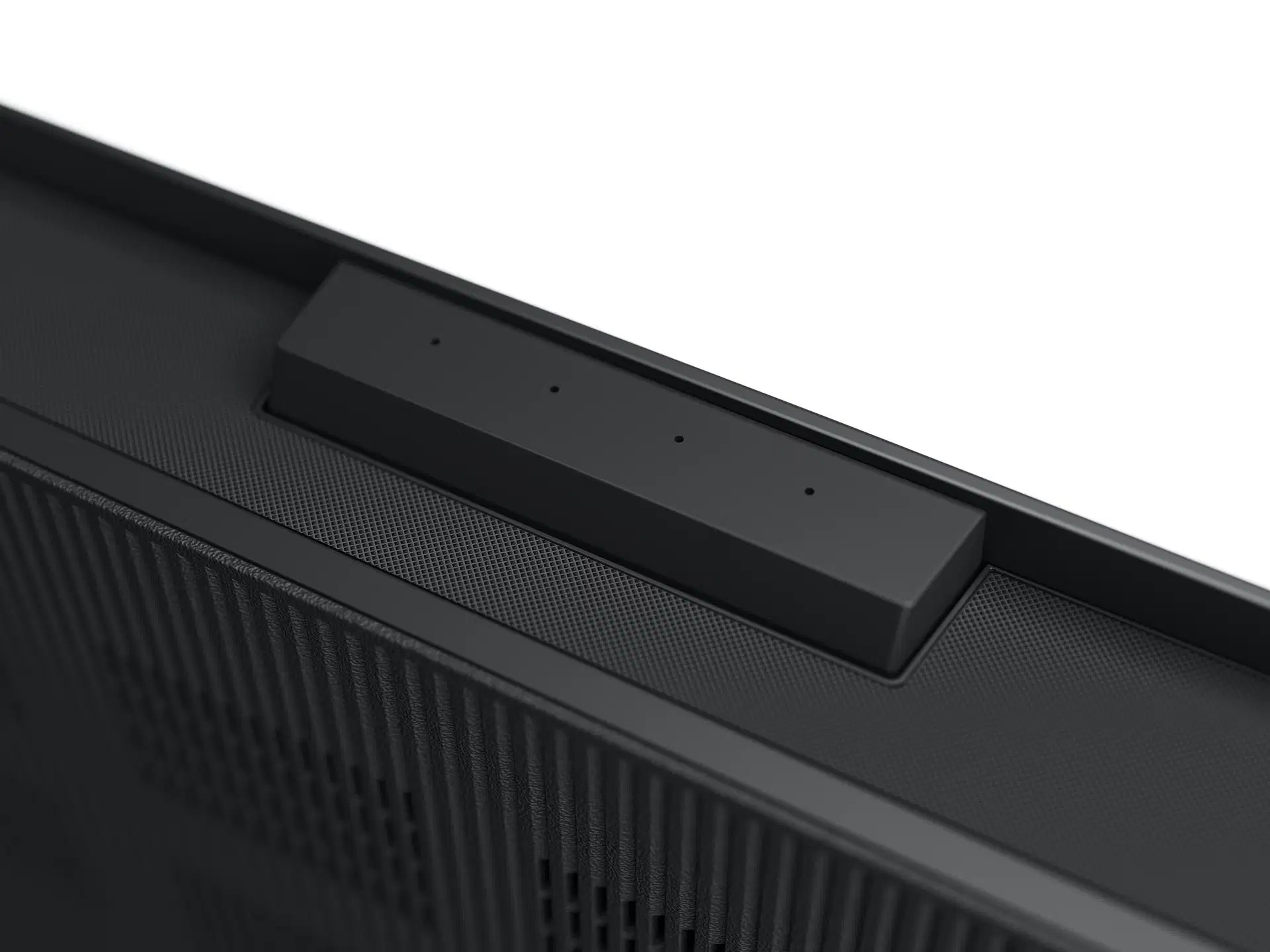 Close-up van een zwarte monitor. Het heeft een ingebouwde balk met drie kleine gaten.