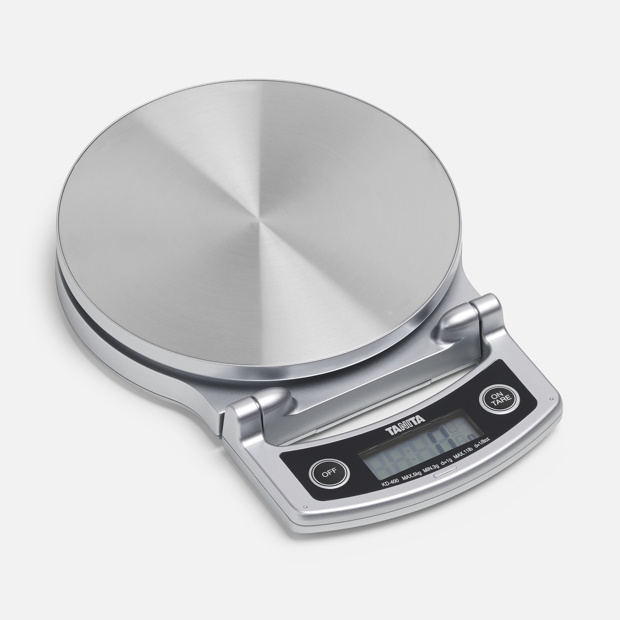 Silver kitchen scale with digital display and buttons, on a white surface.