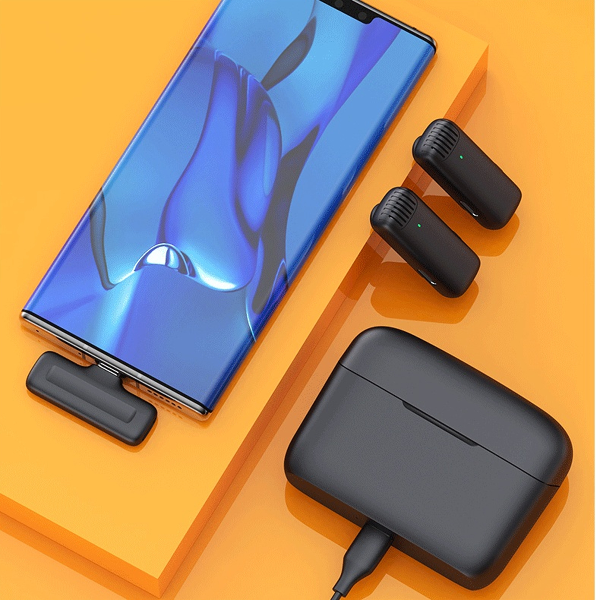 Ein blaues Telefon auf orangener Oberfläche mit zwei schwarzen Mikrofonen und einer schwarzen Ladehülle.