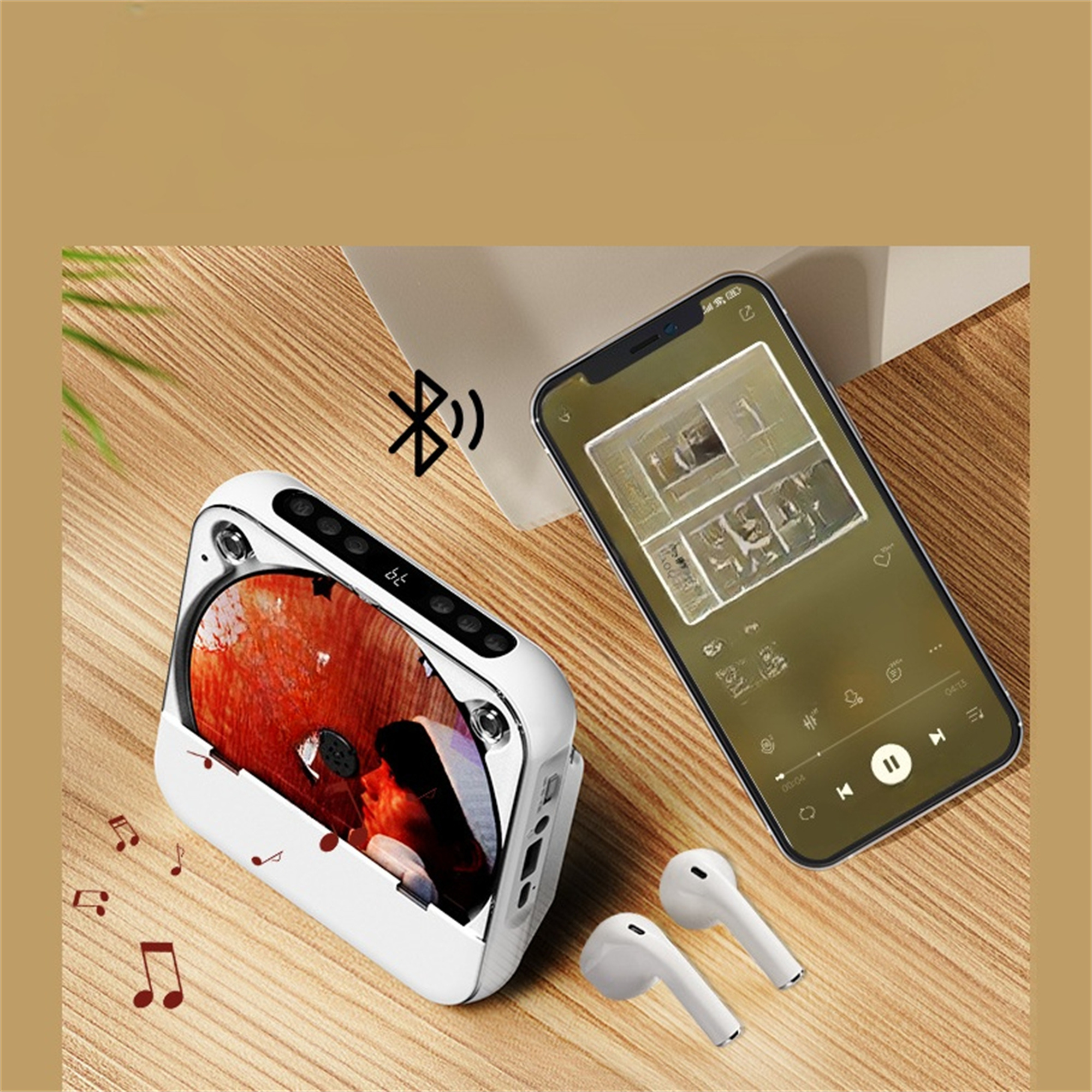 Weißer tragbarer Lautsprecher mit CD, neben Telefon mit Musik-Oberfläche. Ohrhörer dabei.