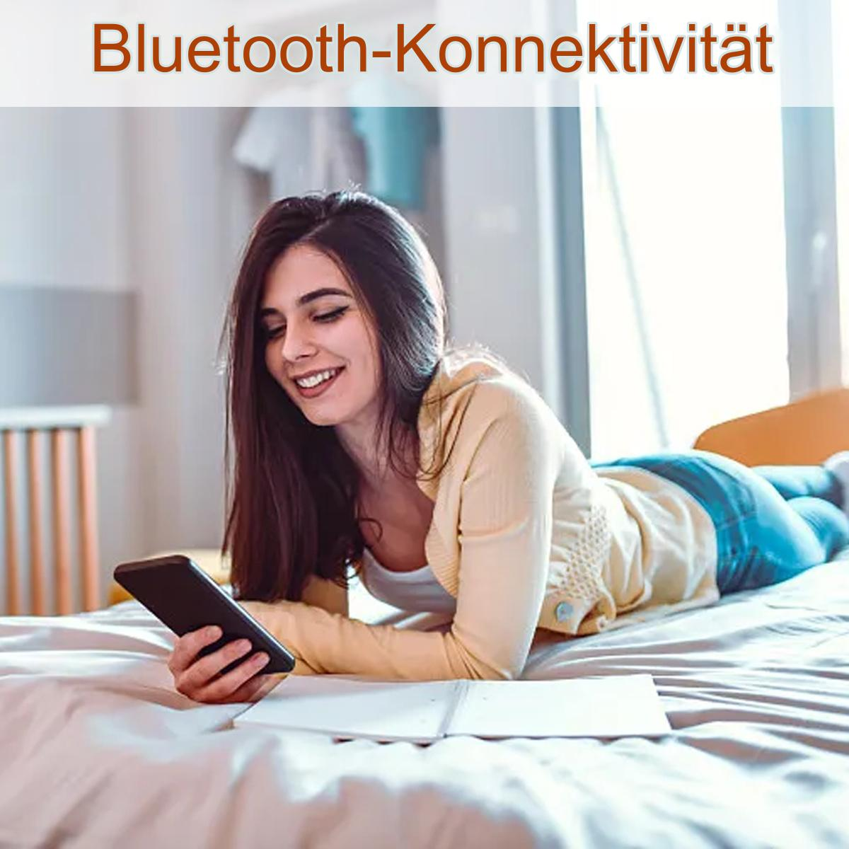 Frau im Bett hält ein Telefon, Text 'Bluetooth-Konnektivität' sichtbar.