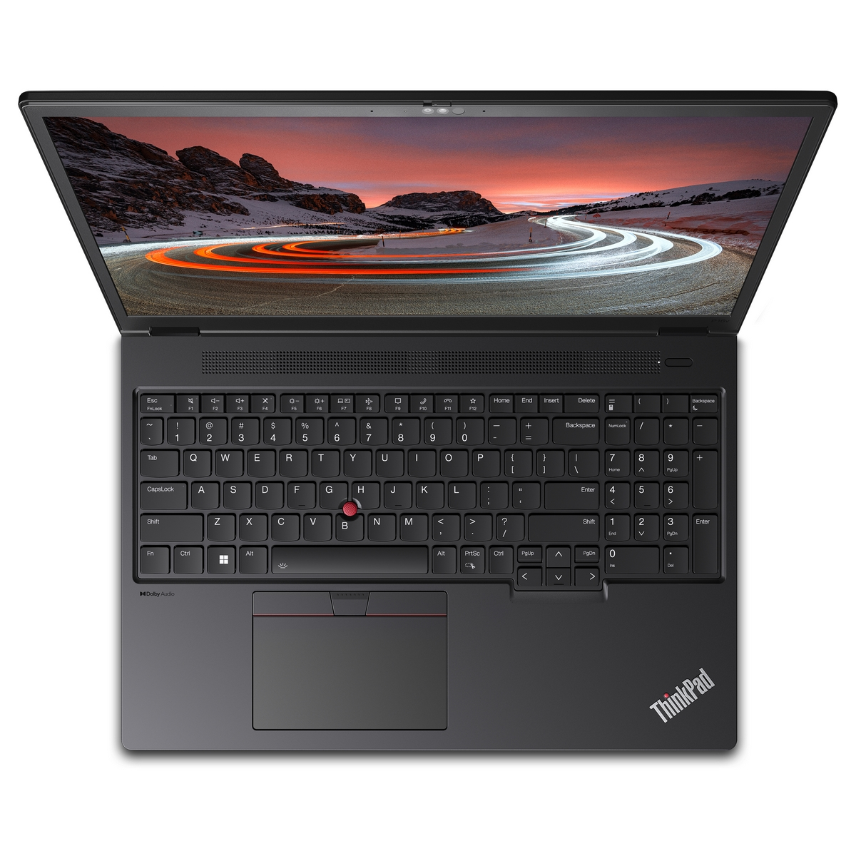 Laptop nero con tastiera e schermo aperto che mostra un paesaggio montano innevato.