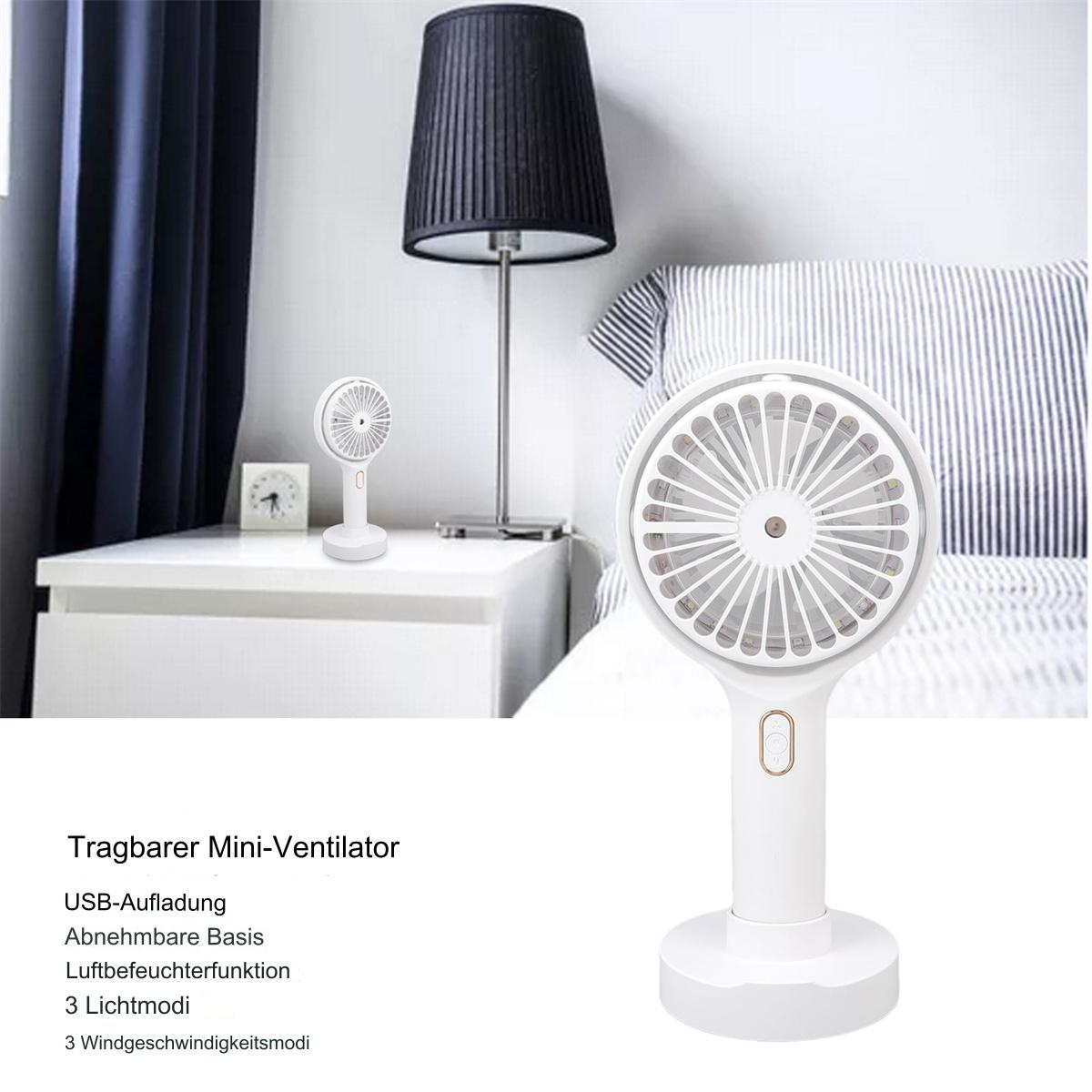 Ein weißer tragbarer Mini-Ventilator auf einem Nachttisch mit einer Lampe und Text darunter.