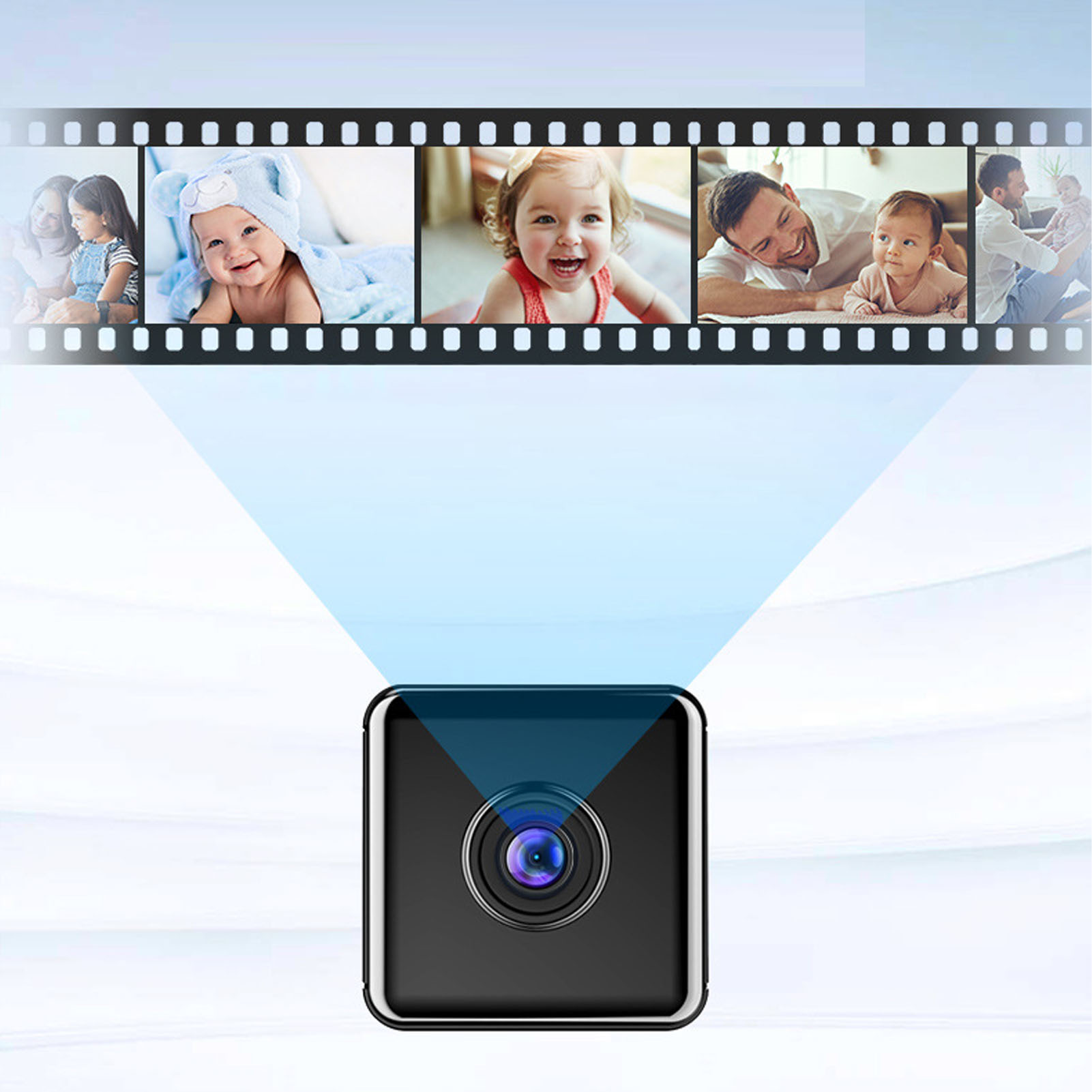 Eine kleine schwarze Kamera projiziert Bilder von Babys und Familien von einem Filmstreifen.