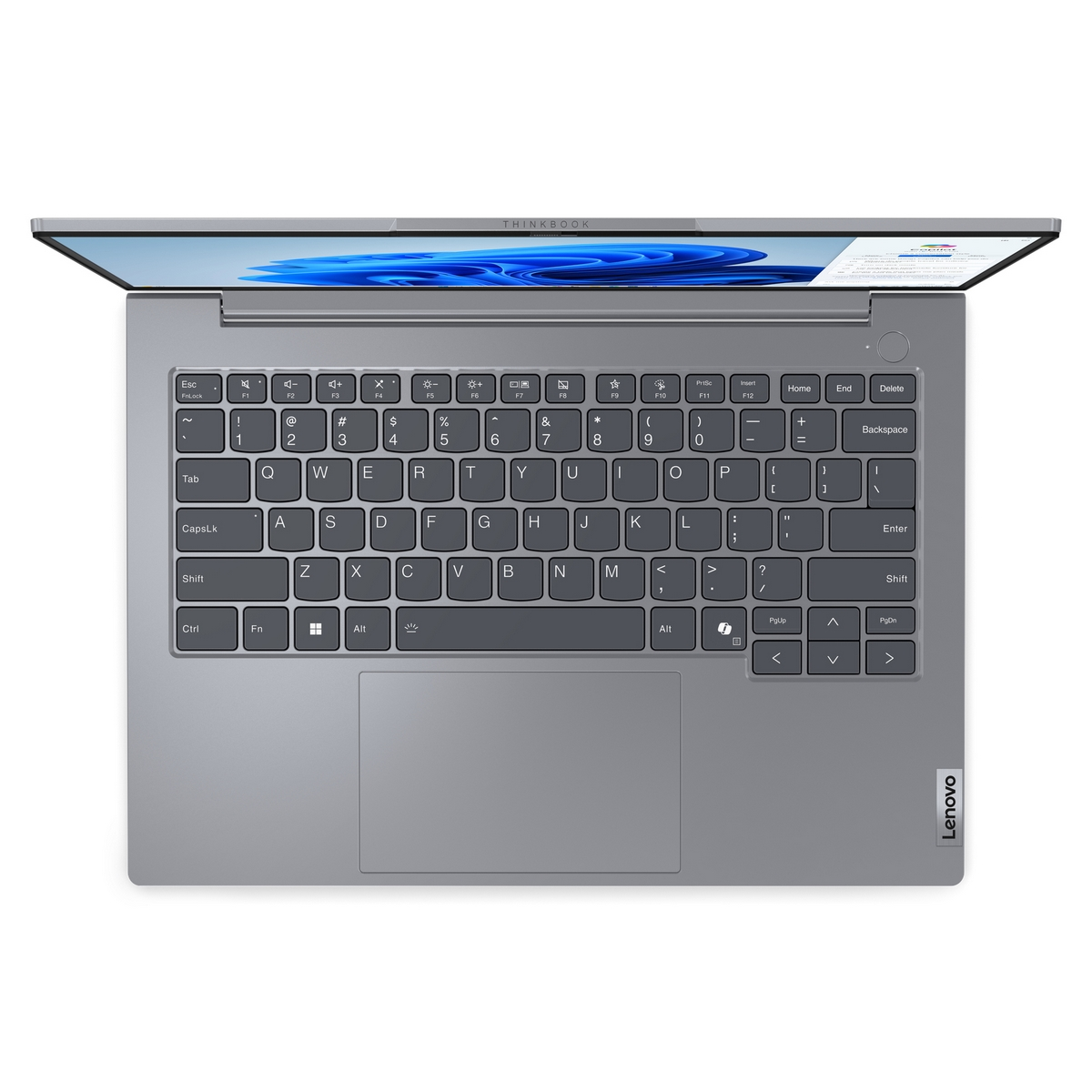 Tastiera del laptop, vista dall'alto, con superficie grigia e logo Lenovo.