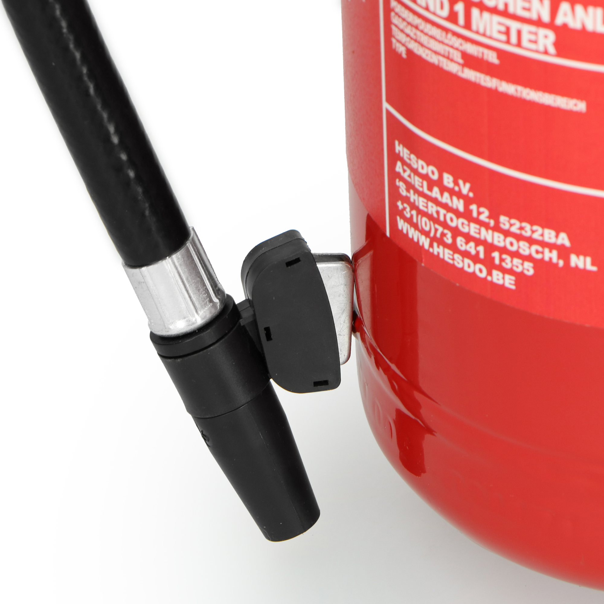 Red fire extinguisher with black hose and nozzle. Details of the label and valve are clearly visible.