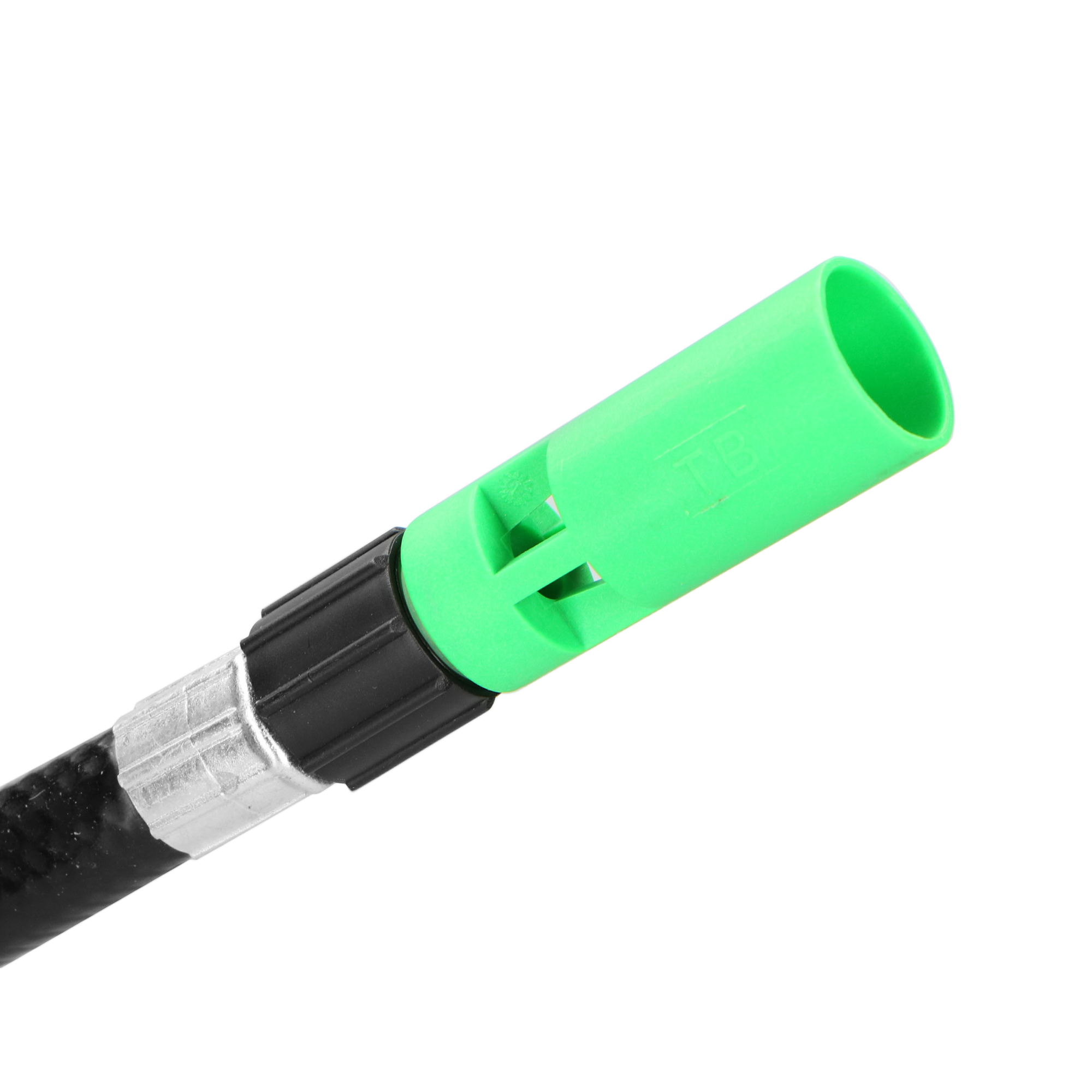 Groen en zwart object, groene punt, waarschijnlijk een gereedschapsonderdeel.