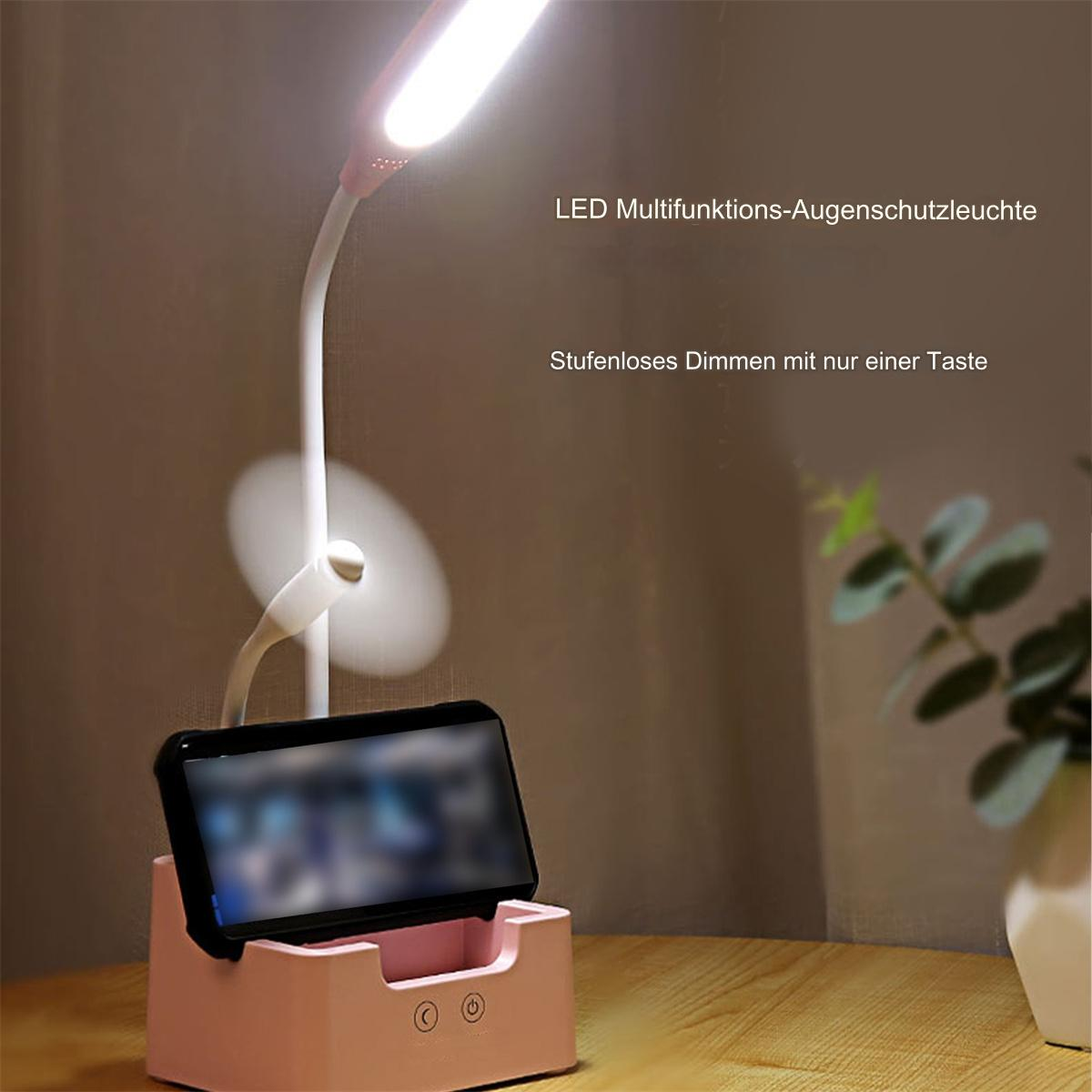 Rosa Schreibtischlampe mit Telefonhalter und Lüfter. Der Hintergrund ist ein Holzschreibtisch.