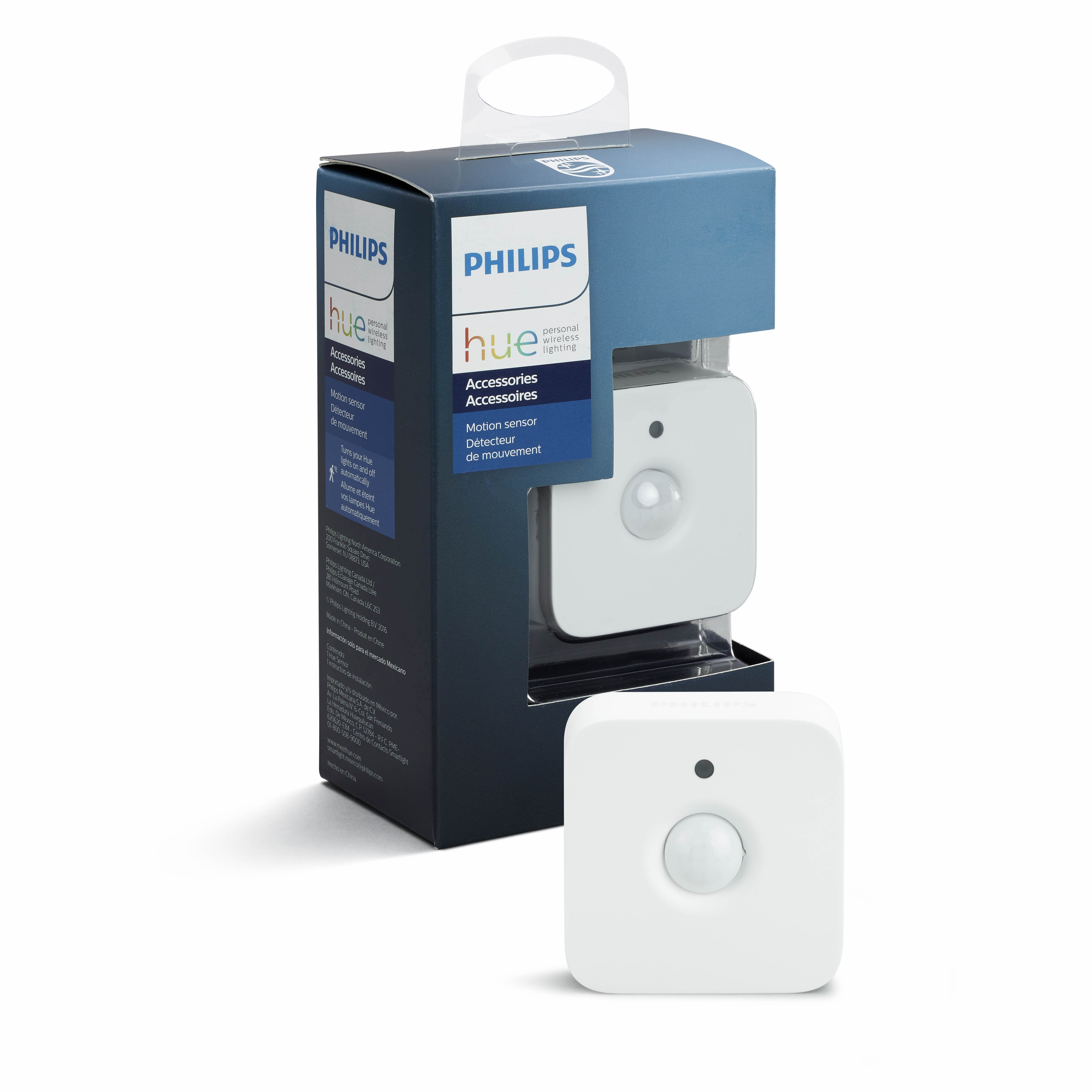 Een Philips Hue bewegingssensor en de verpakking. Witte sensor in een blauw-witte doos.