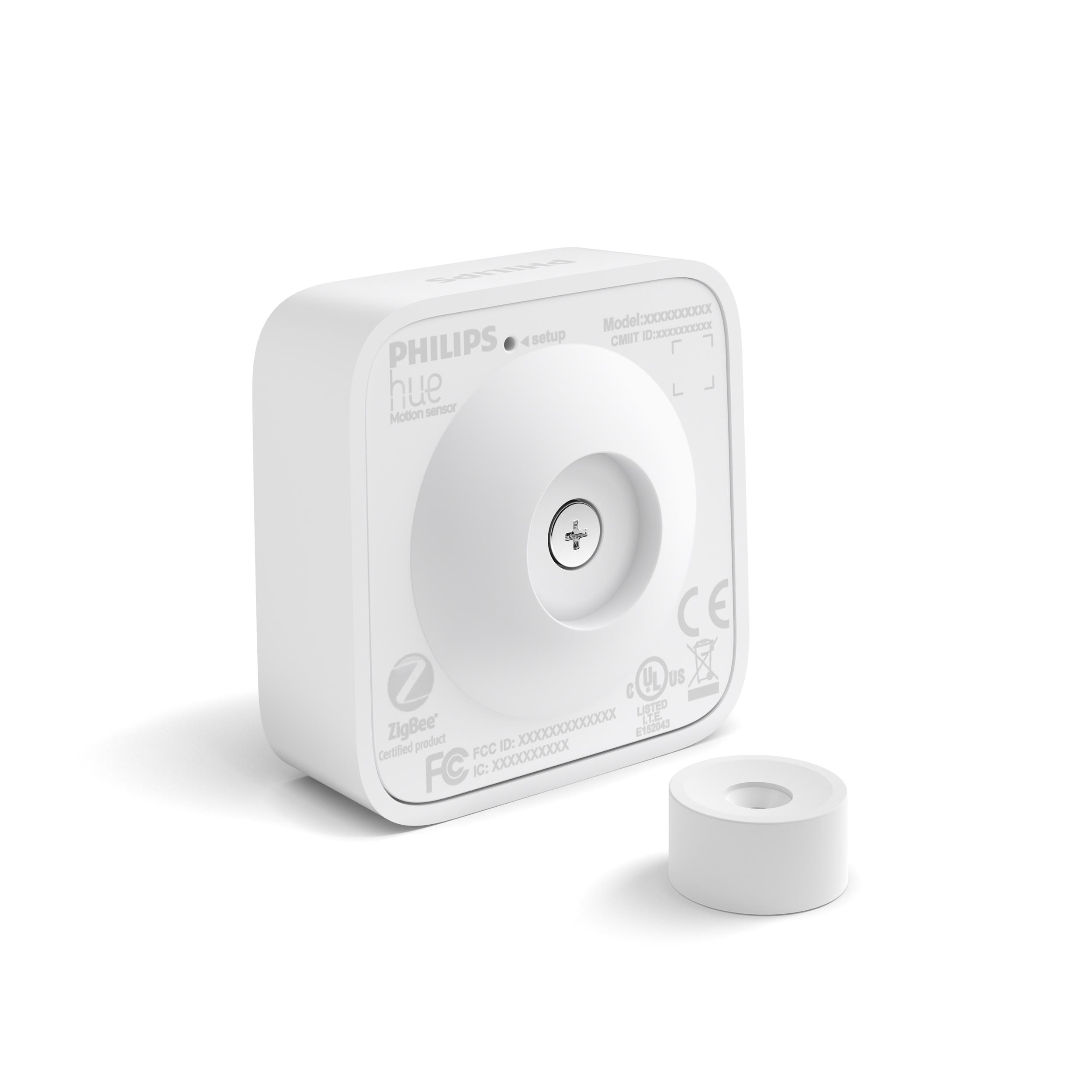 Ein weißer Philips Hue Bewegungsmelder mit Schraube und kleiner Halterung.