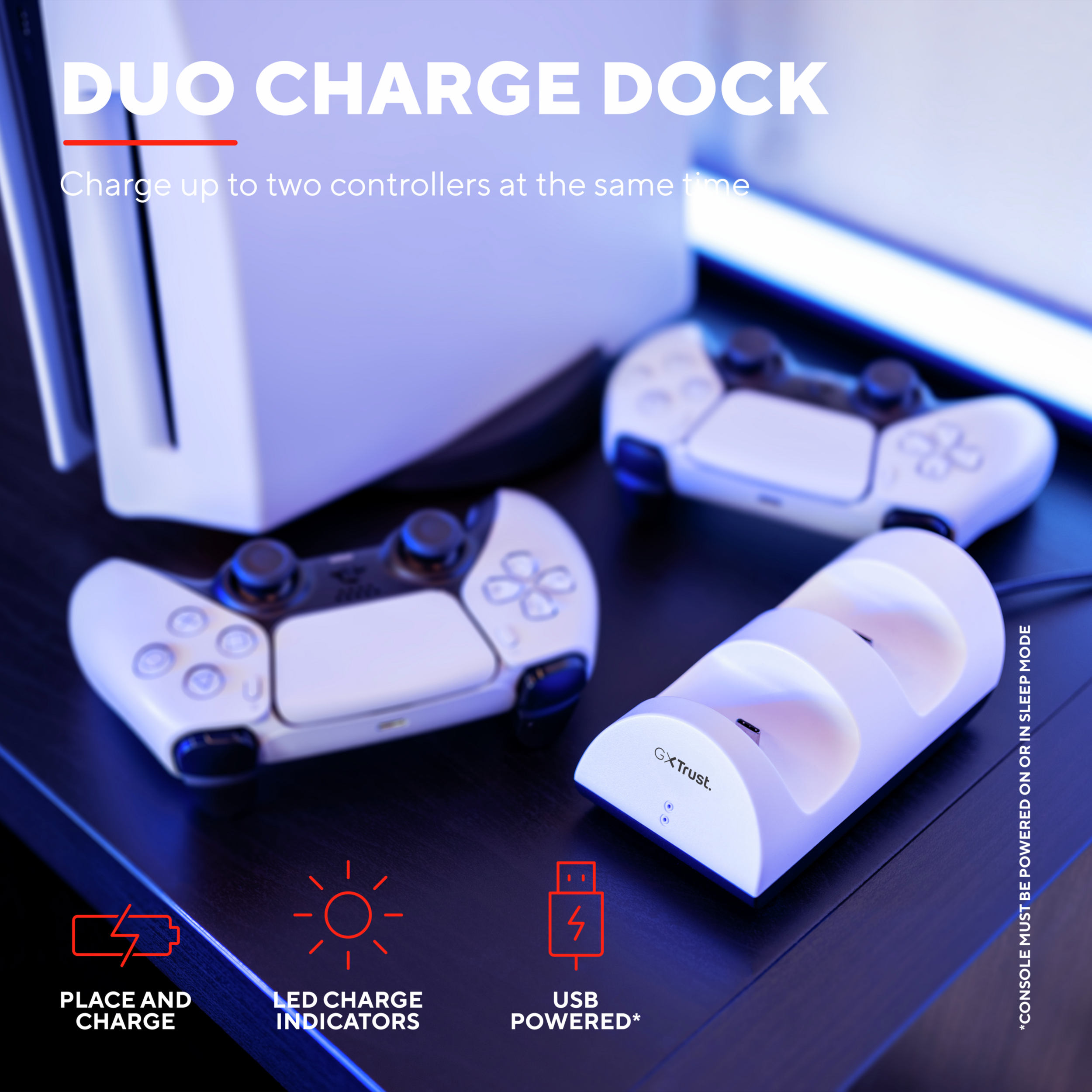 A white charging dock with two game controllers on a black surface, with text and icons.