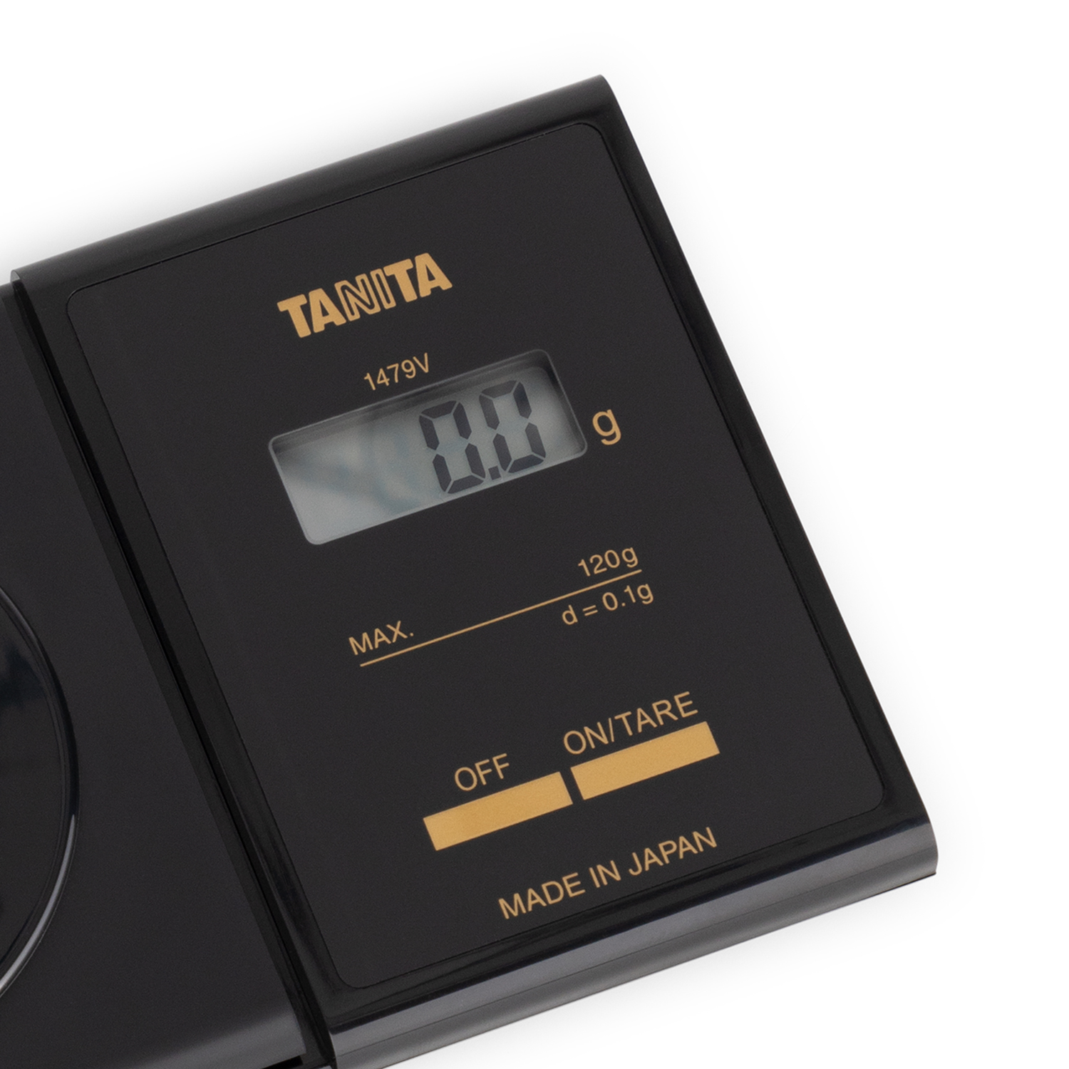 Schwarze Digitalwaage mit Anzeige von 0,0 g. Hat Tasten für Aus/Ein und Tara. Weißer Hintergrund.