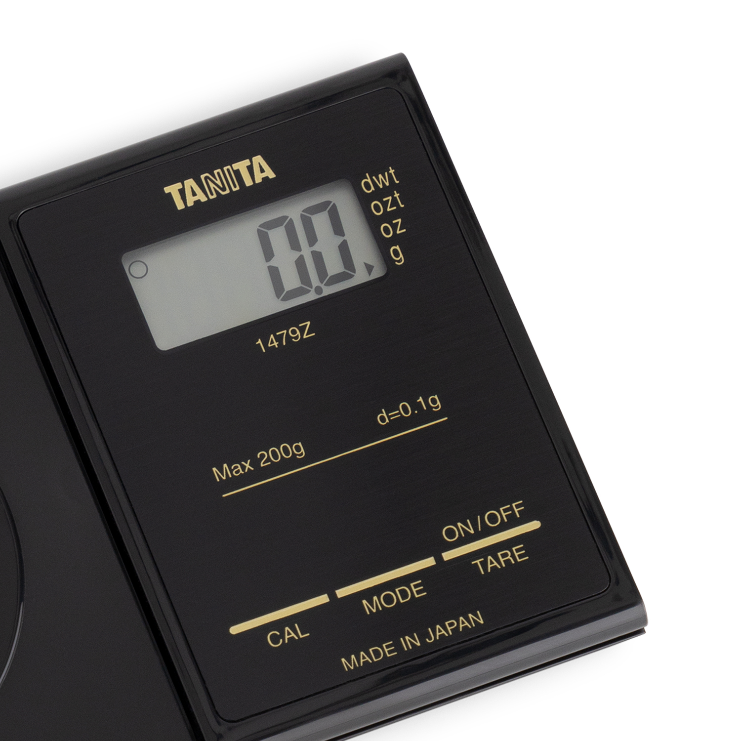 Schwarze Digitalwaage mit LCD-Anzeige, die '0.0' anzeigt. Tasten für Modus, Tara und Ein/Aus. Hergestellt in Japan.