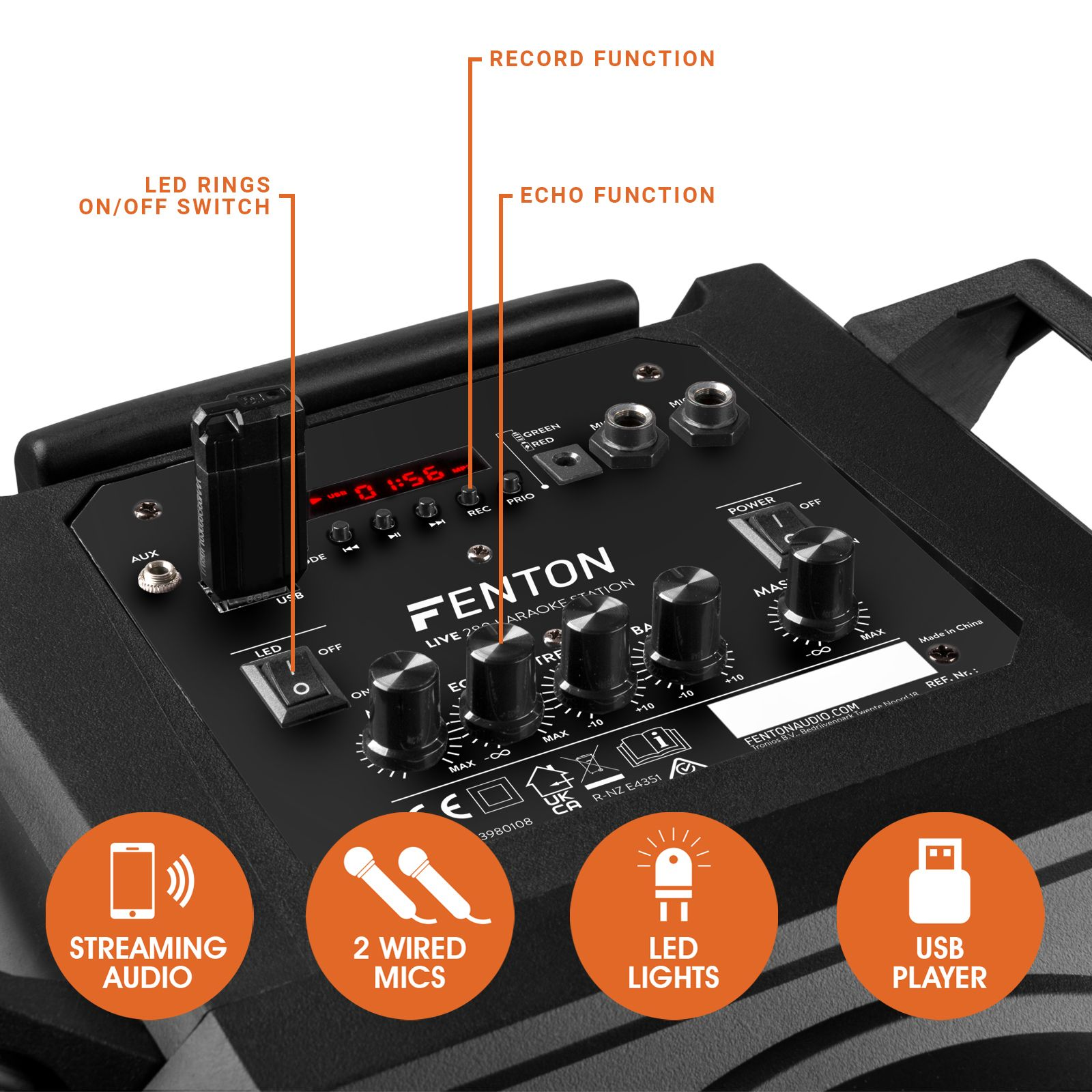 Máquina de karaoke con botones, puertos e iconos para streaming, micrófonos, luces y USB. Las etiquetas de texto incluyen LED, AUX y Record.