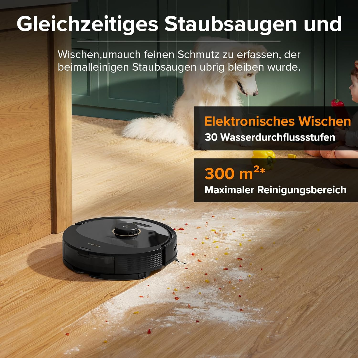 Czarny robot sprzątający na drewnianej podłodze. Widoczny pies, obecny tekst.