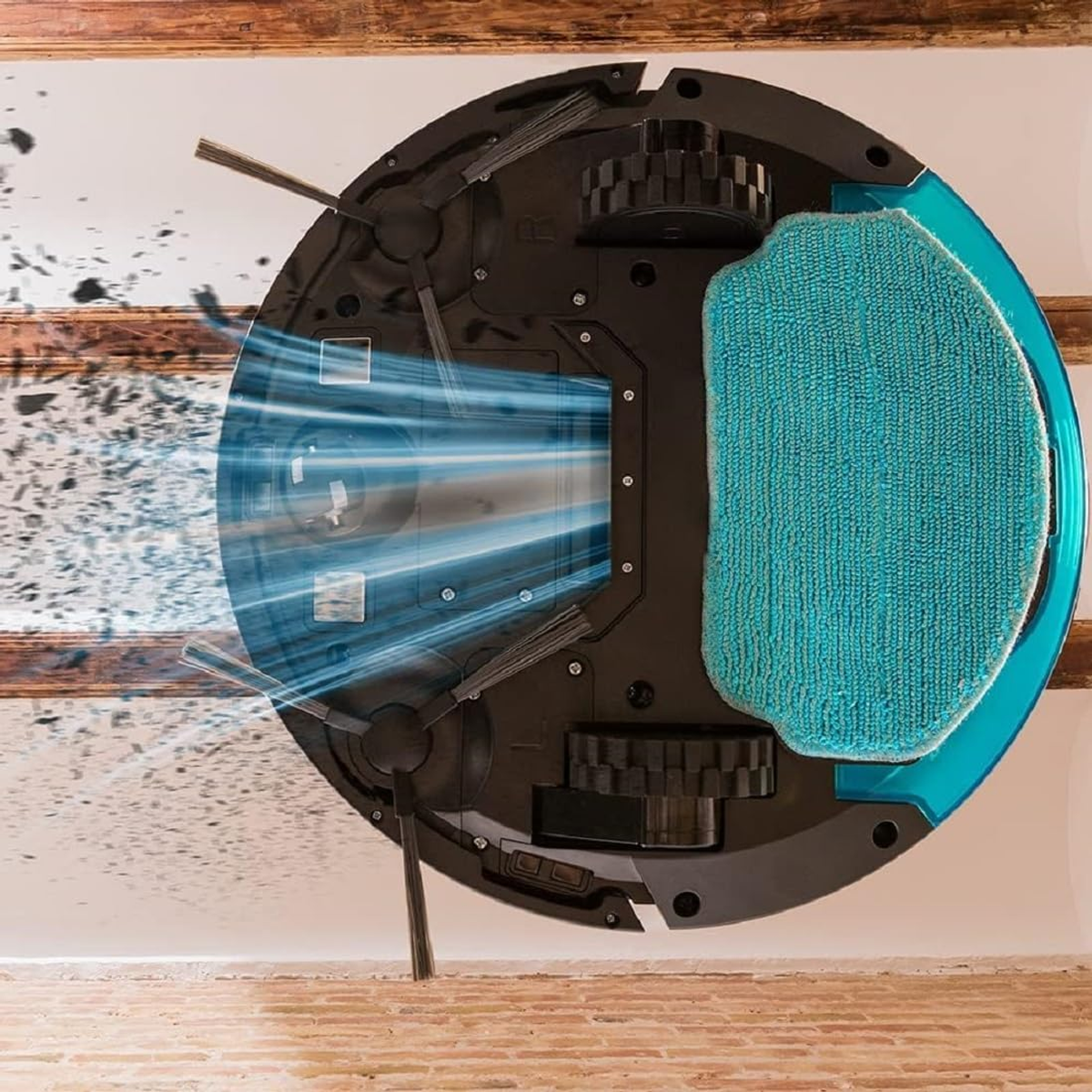 Robot sprzątający czyszczący podłogę. Niebieskie światło wskazuje trasę odkurzacza.