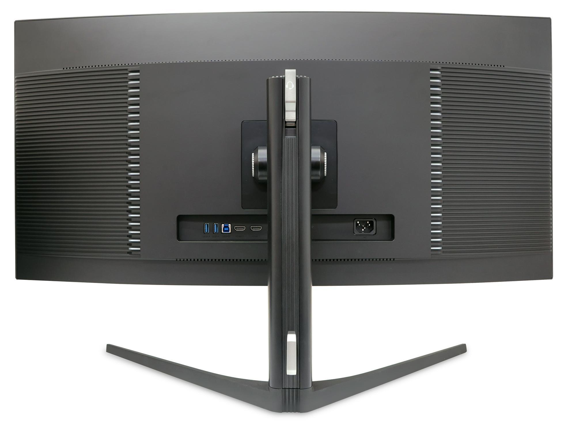 Zakrzywiony czarny monitor komputera z tyłu, ze srebrną podstawą i wieloma portami.